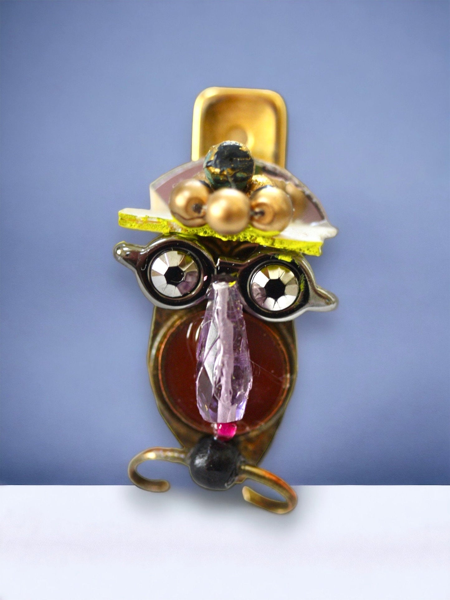 Meet "Henrietta."  Henrietta is a really cool assemblage art gal who can be transformed into a necklace, pin, magnet, bottle or little dish