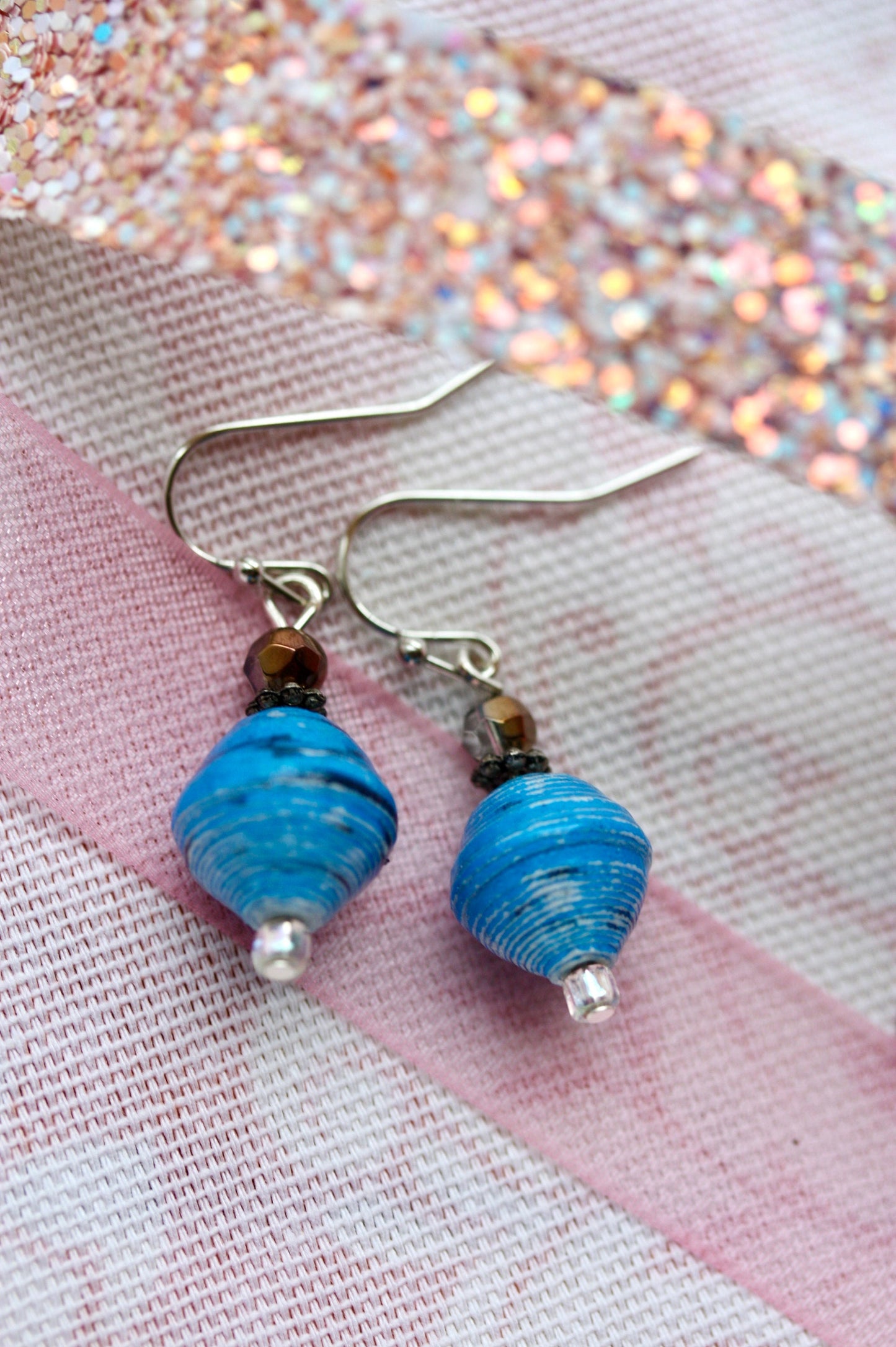 Little dangle earrings made with blue rolled paper, crystal and white sparkly glass beads