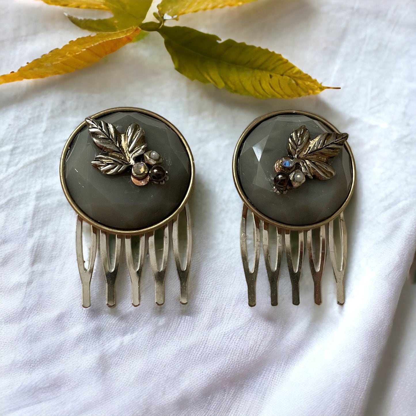 Pair of small 1" silvery gray round hair combs with silver leaves, rhinestones, faux baby pearls and upcycled metal components
