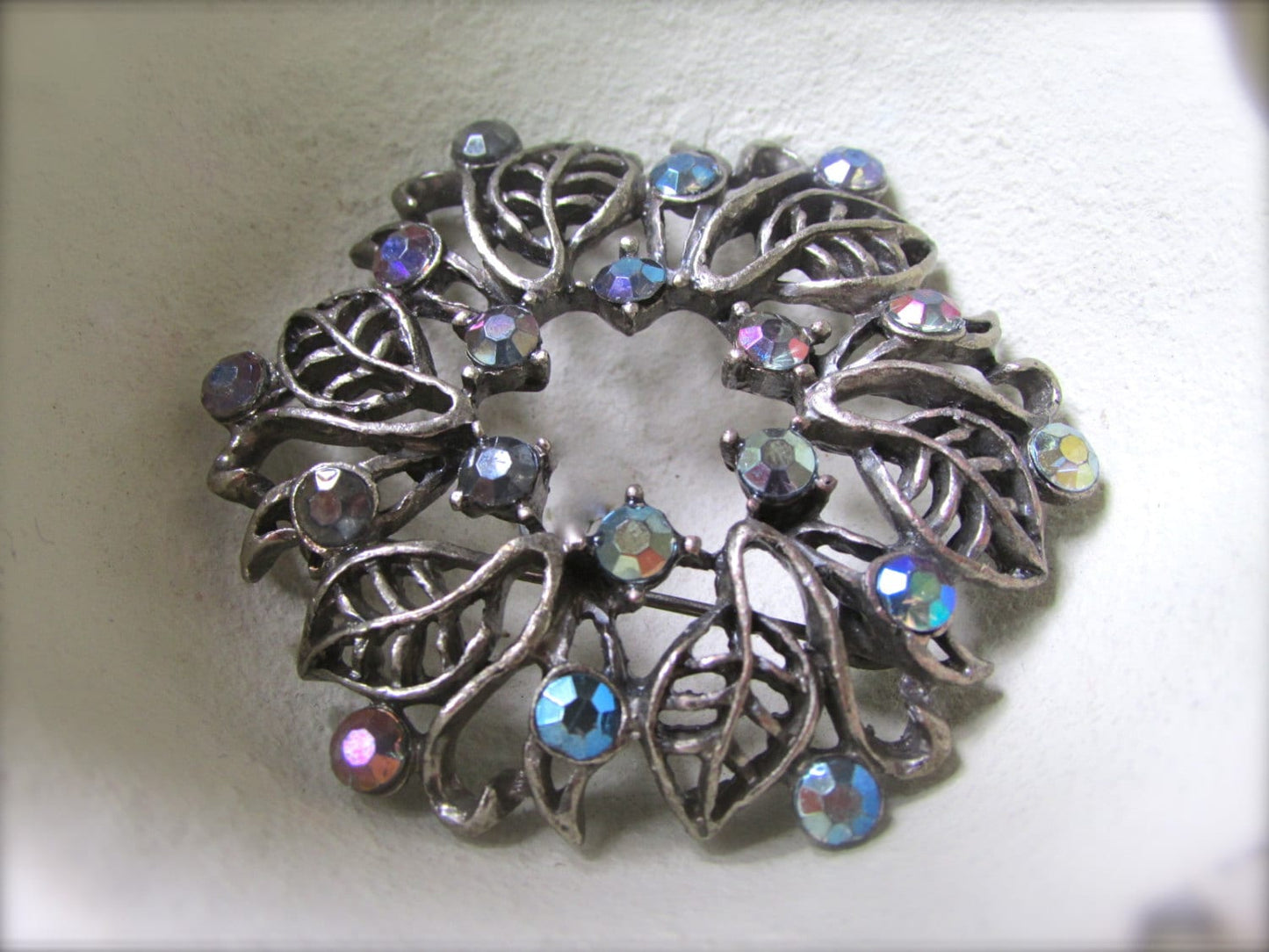 Vintage silver leaf and rhinestone wreath pin