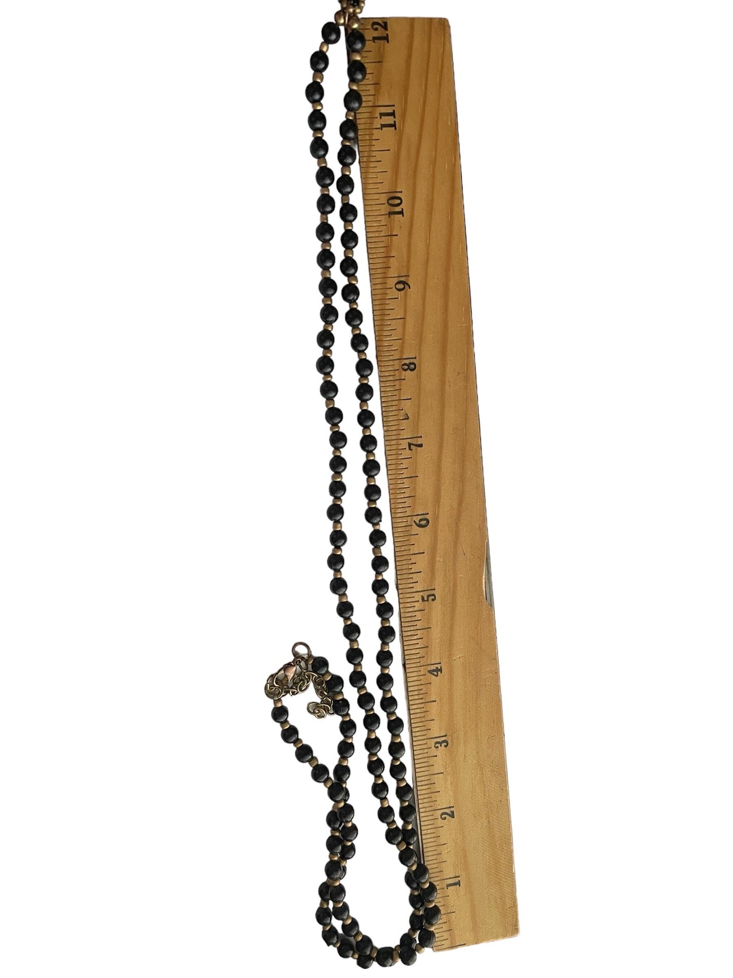 Stunning and unique hand beaded vintage artisan black and gold tassel necklace