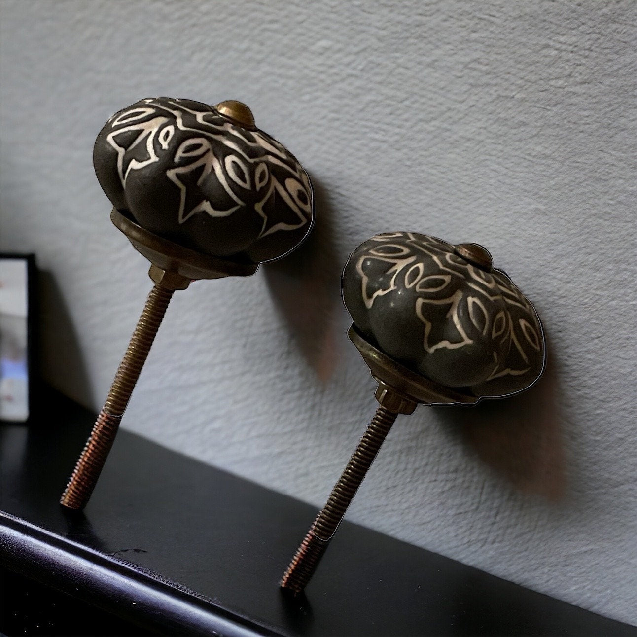 Pair of black and white vintage drawer pulls