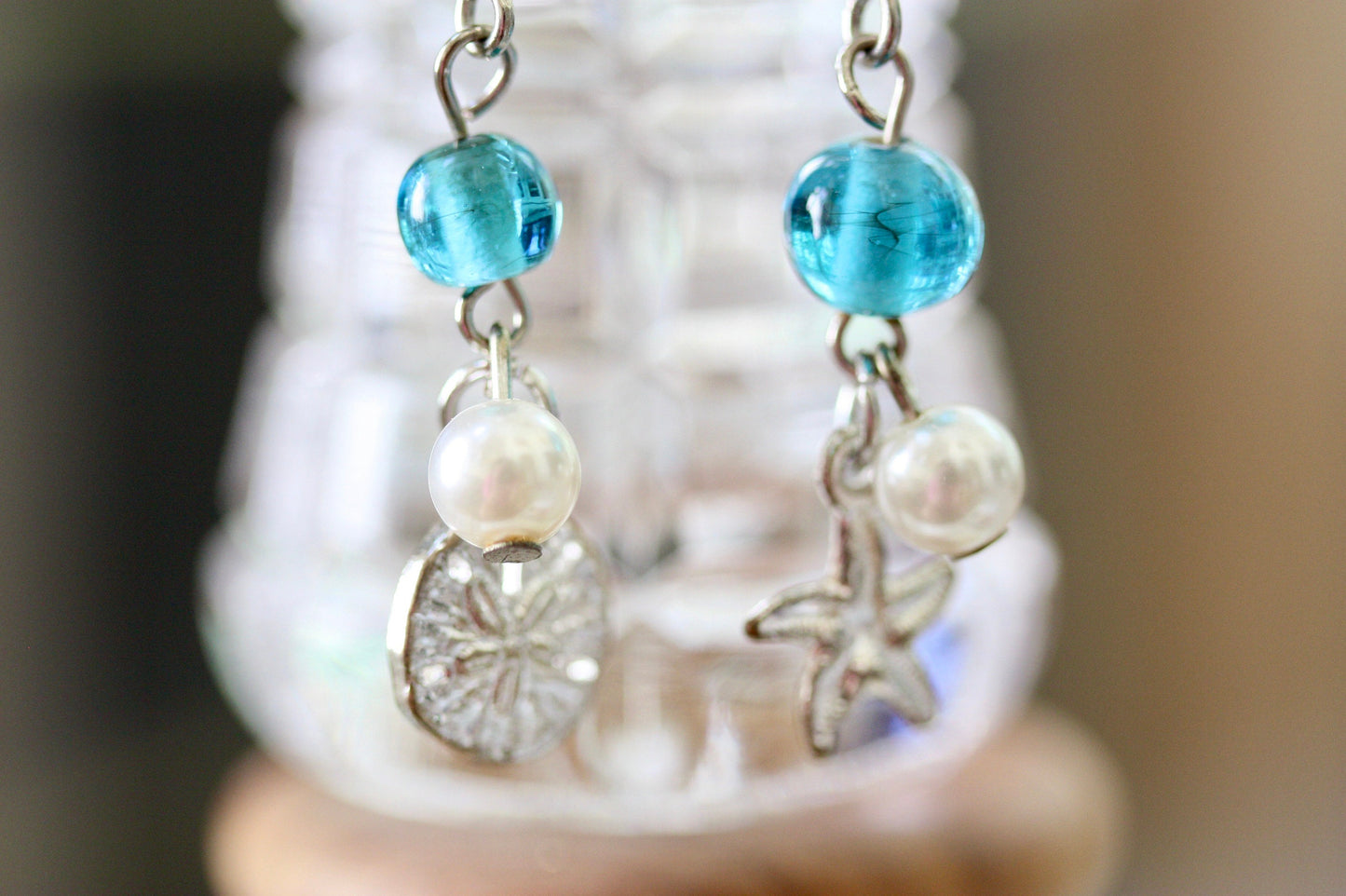 Faux pearl, clear crystal and recovered blue vintage glass dangle earrings with starfish and silver dollar metal shell