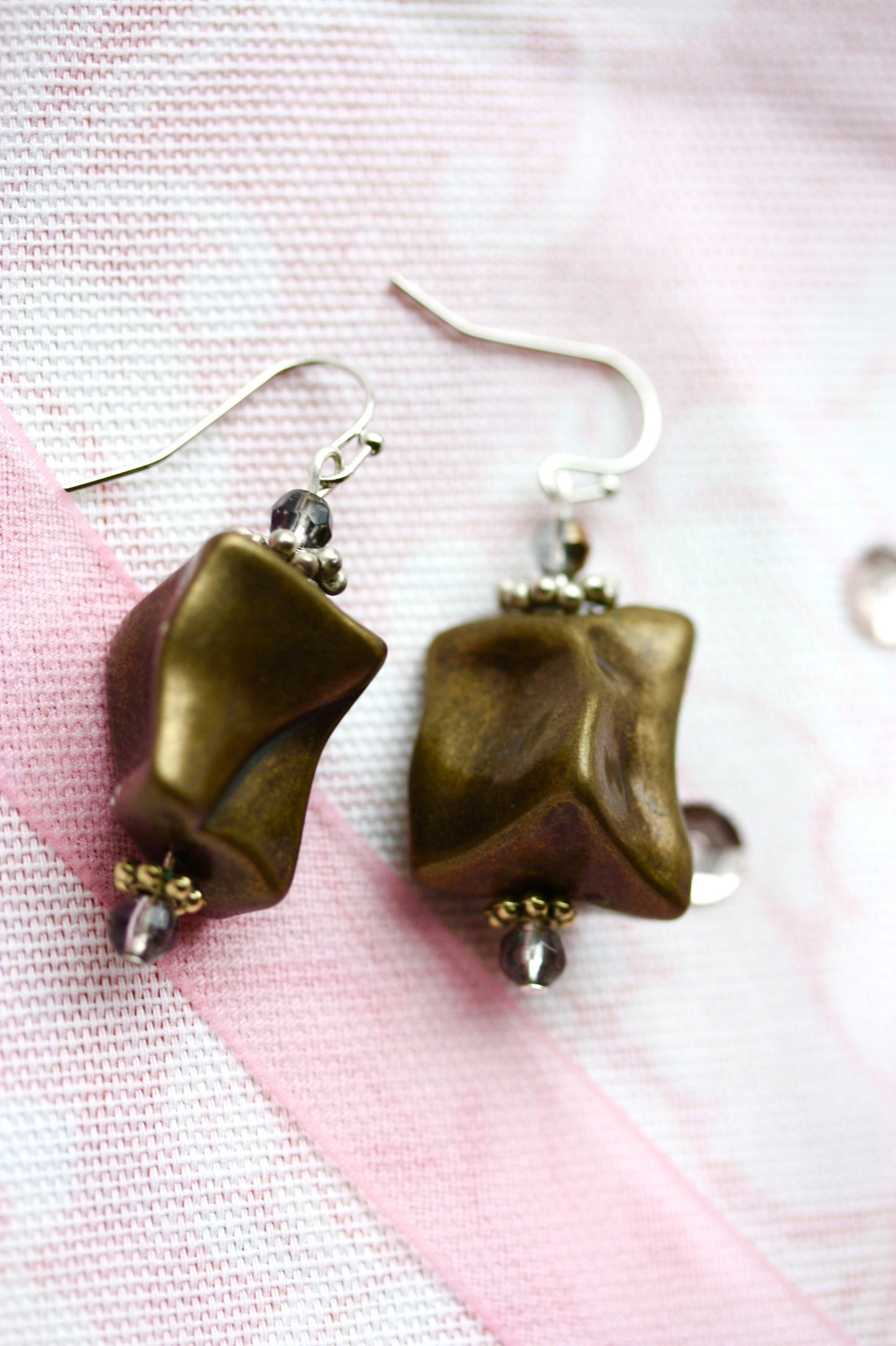 Handmade dangle earrings made with uniquely shaped faux stone beads