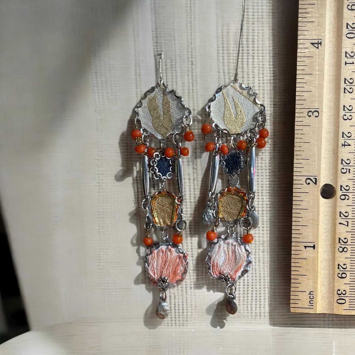 Orange and blue denim mixed media collage earrings with mixed fabrics and metals; Sterling silver ear wires