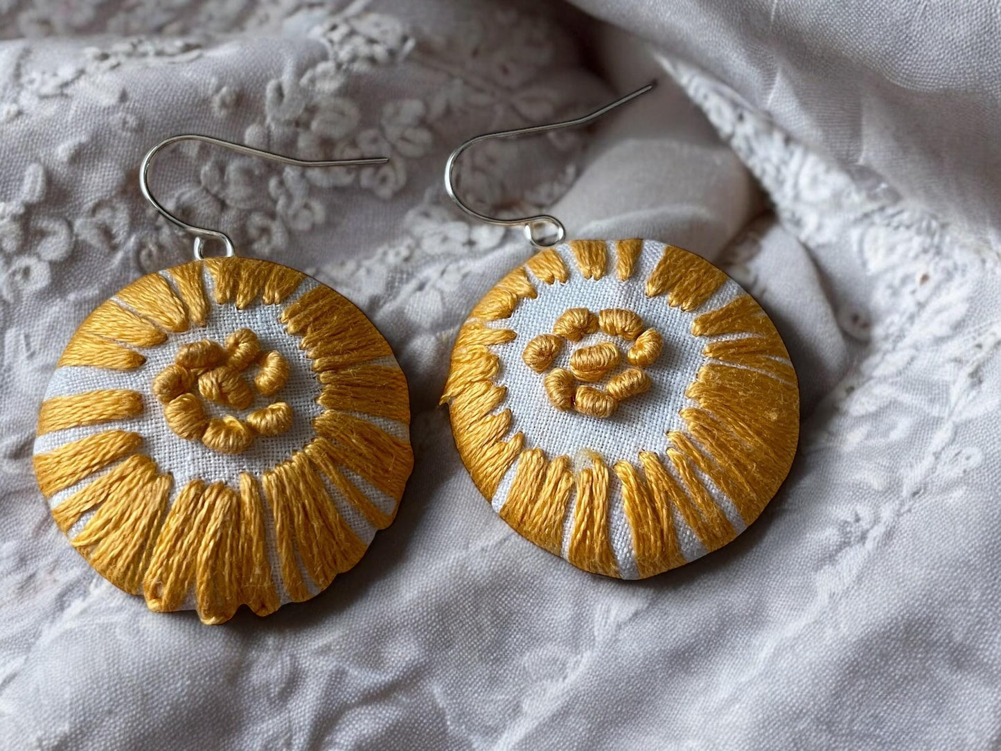 Choice of stud earrings, dangle earrings, hair combs, shanked buttons or pins all hand made from a vintage linen embroidered table runner