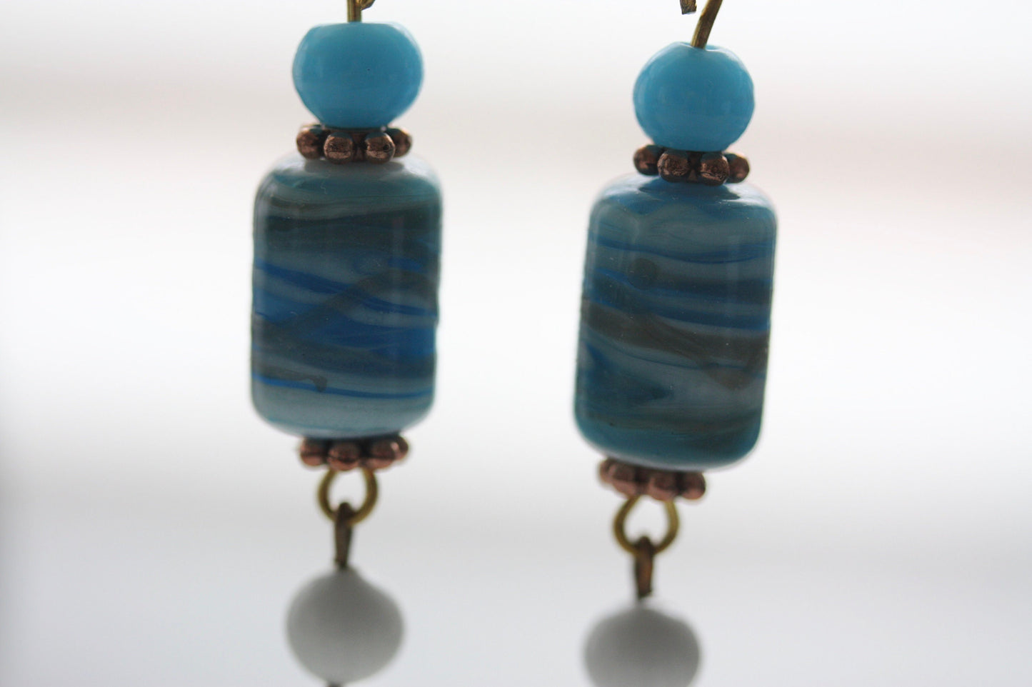 Long dangle earrings made of both new and vintage components -blue and gold art glass, mother of pearl dangles,vintage blue and white beads