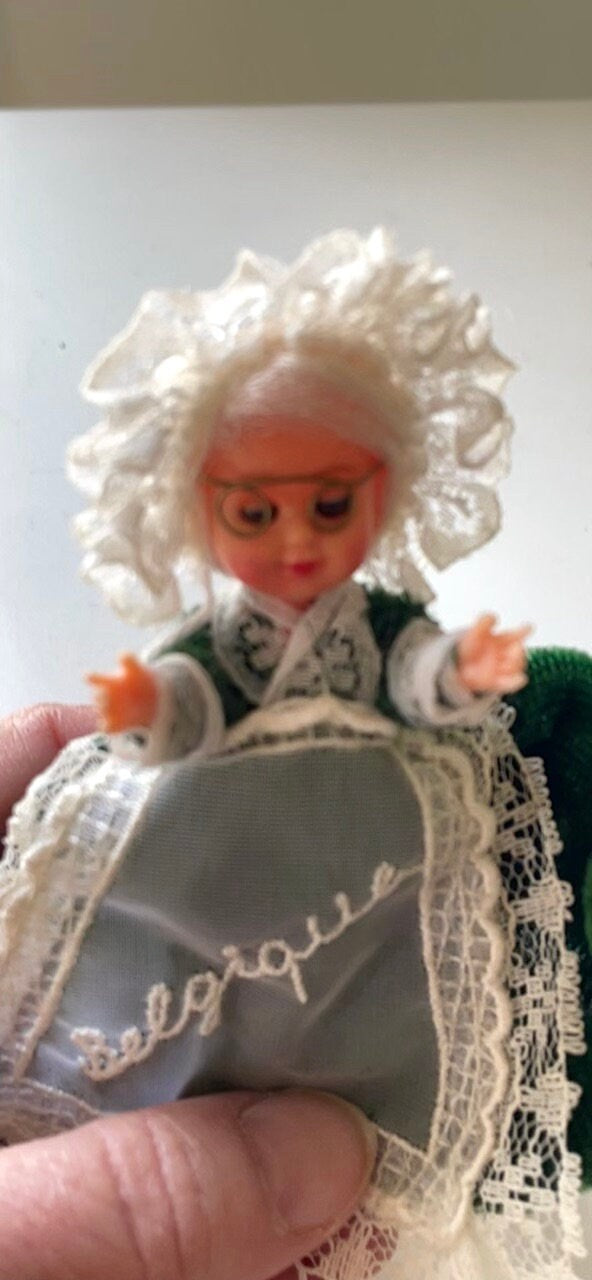 Stunning vintage collectible art baby Doll from Belgium with green velvet dress and lace overlay