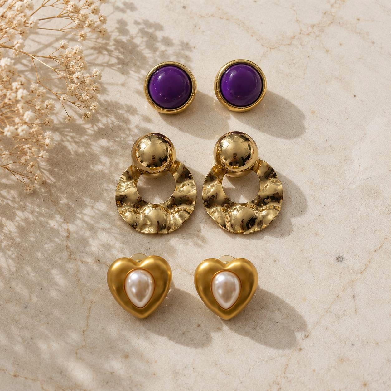 Vintage Pierced Earring Lot of 3 Pairs – Purple Cabochons, Gold Tone Hammered Hoops & Faux Pearl Hearts – Retro Statement Jewelry Collection