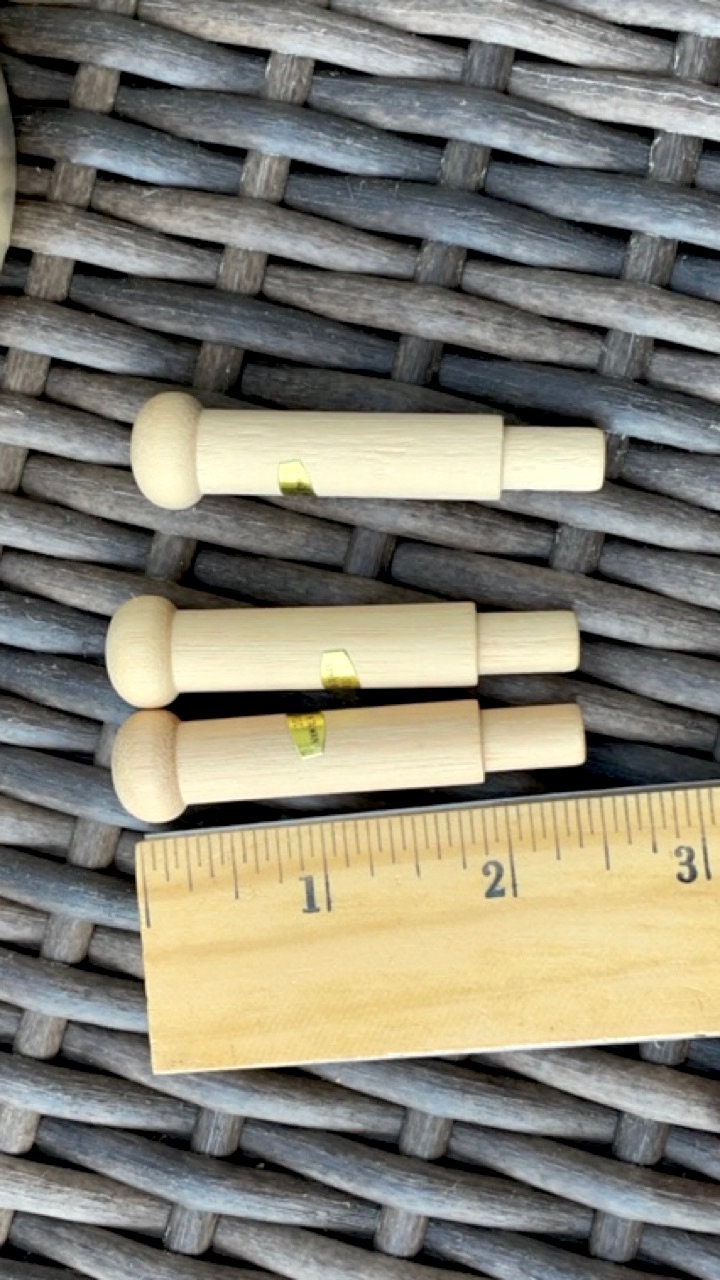 Unfinished solid wood pegs - great as craft supplies - for coat racks, doll making, wood sculptures, mixed material projects, etc.
