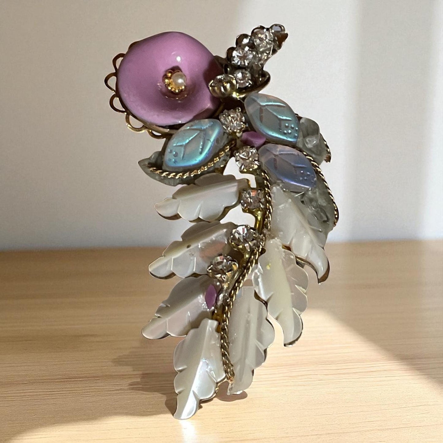 Unique mixed material brooch pin - pink enameled flower with faux pearl center, mother of pearl & white iridescent glass leaves, rhinestones