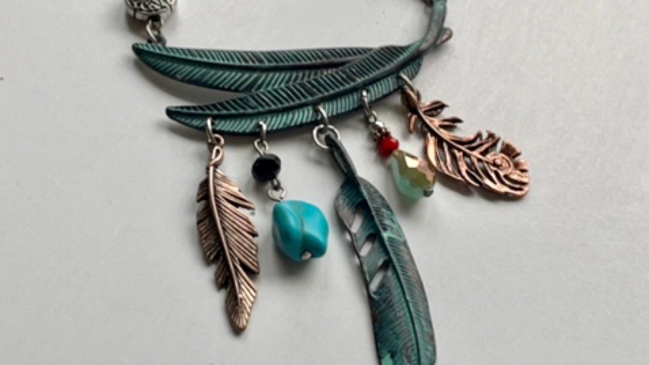 Mixed material feather and charm vintage artisan necklace