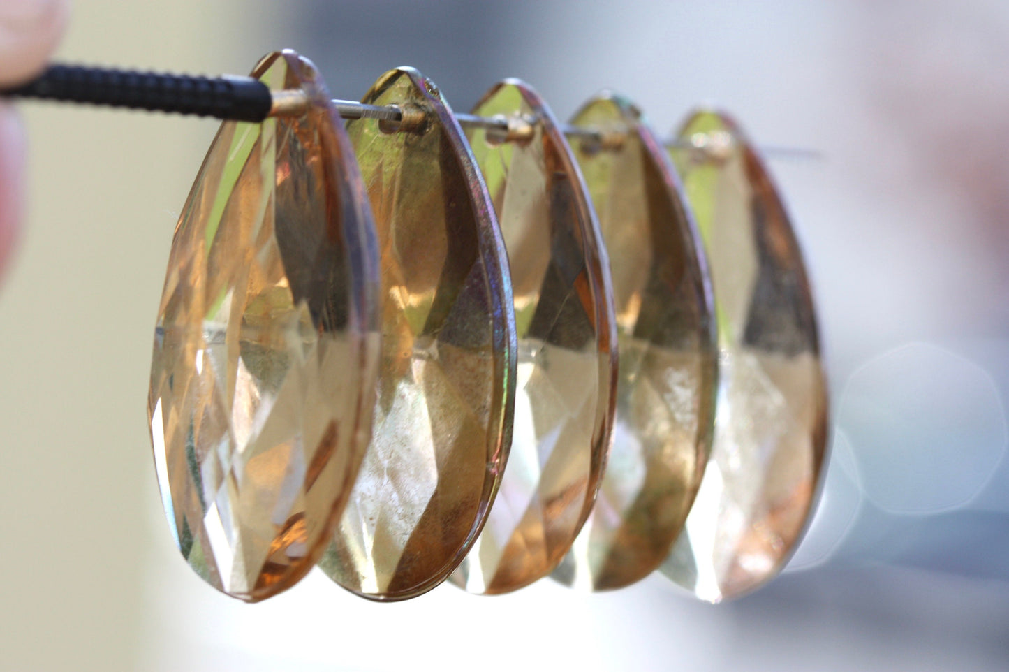 Large light gold glass golden teardrop crystals from a vintage chandelier