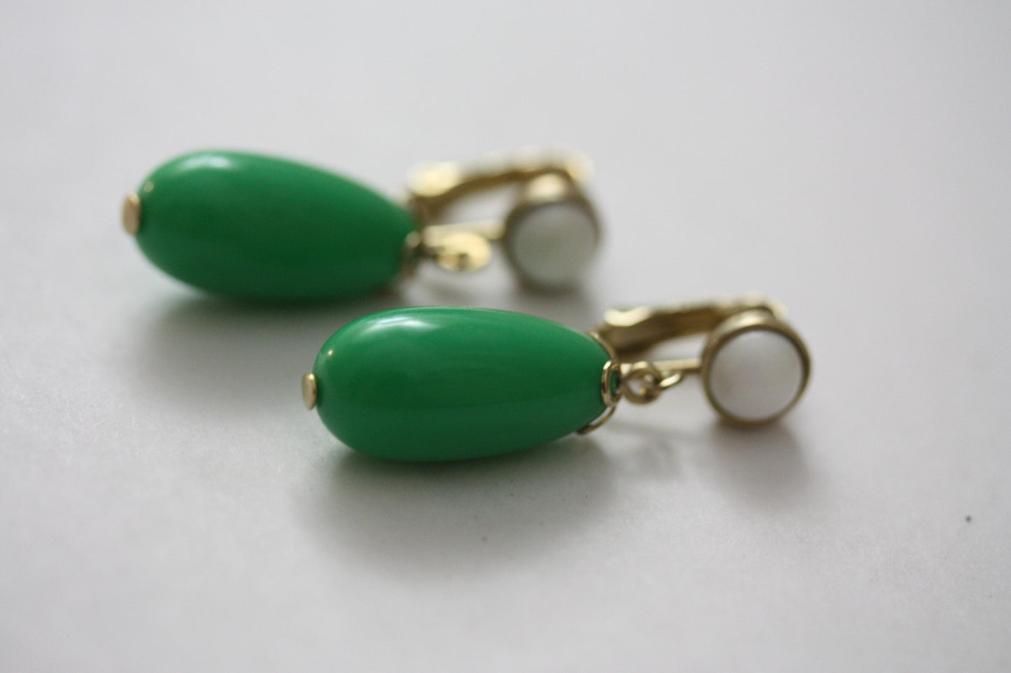 Green and white vintage Avon clip on dangle earrings