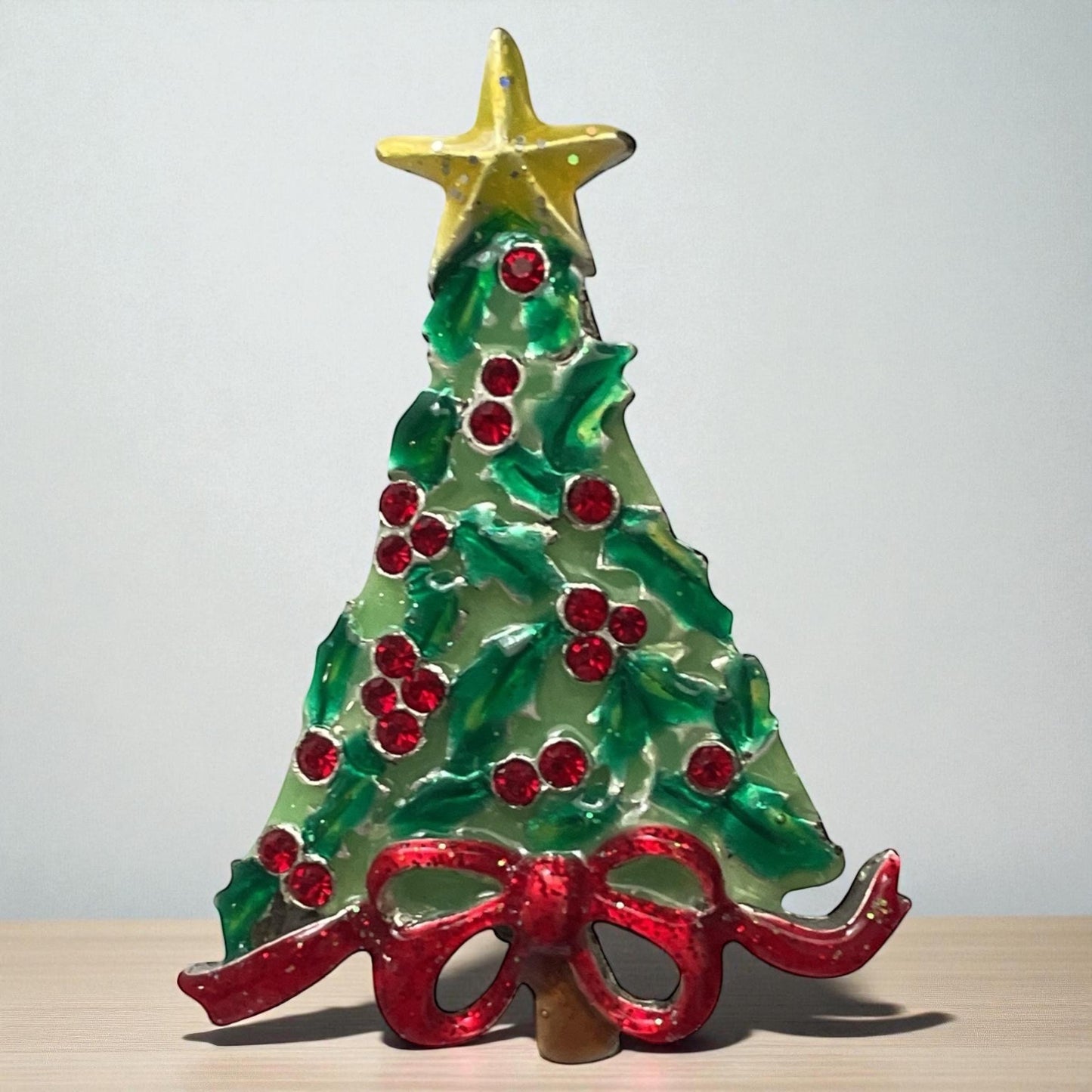 AJMC Christmas Tree Pin • Vintage Enamel Holiday Brooch with Red Rhinestones & Star Topper