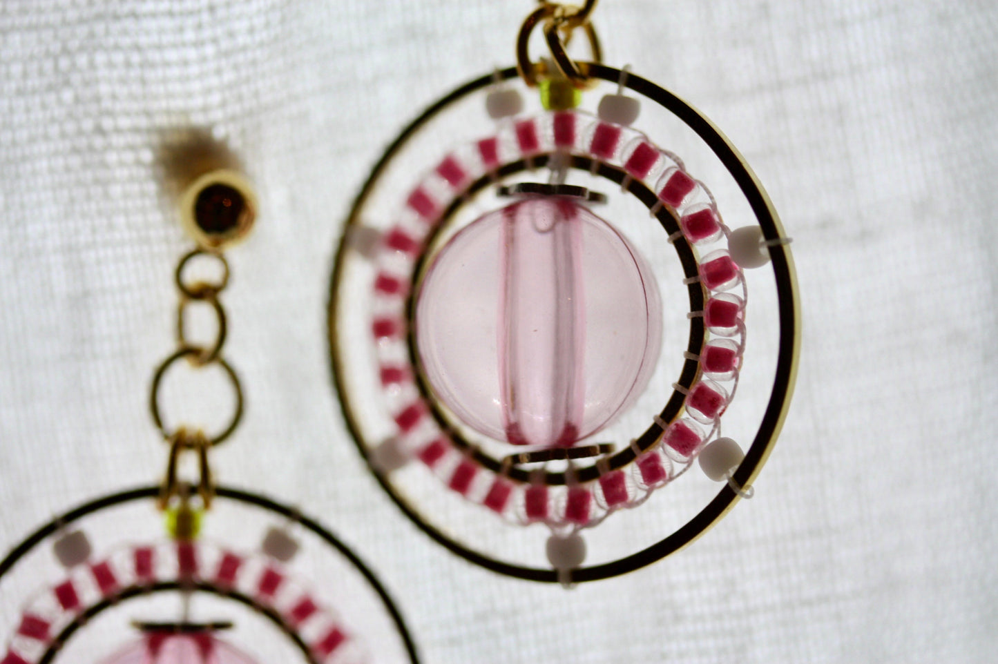 Pink and white intricate beadwork small circular dangle earrings