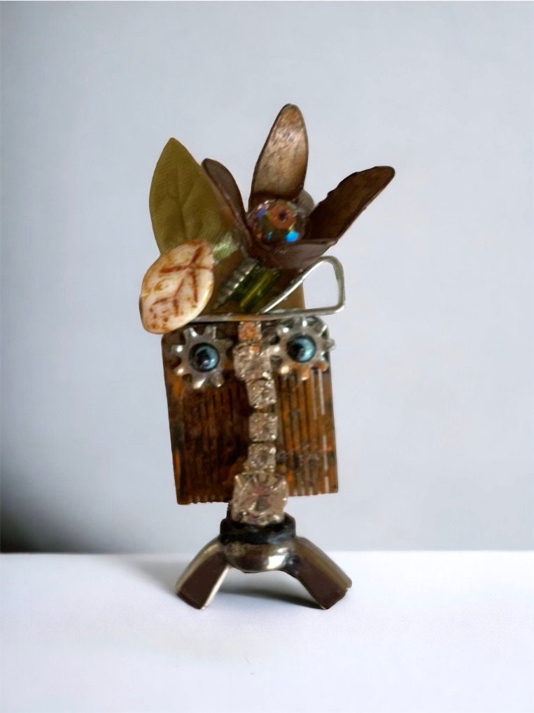 Meet "Gert" a mixed material piece made of parts of a vintage Swiss music box, along with hardware - pin or necklace pendant