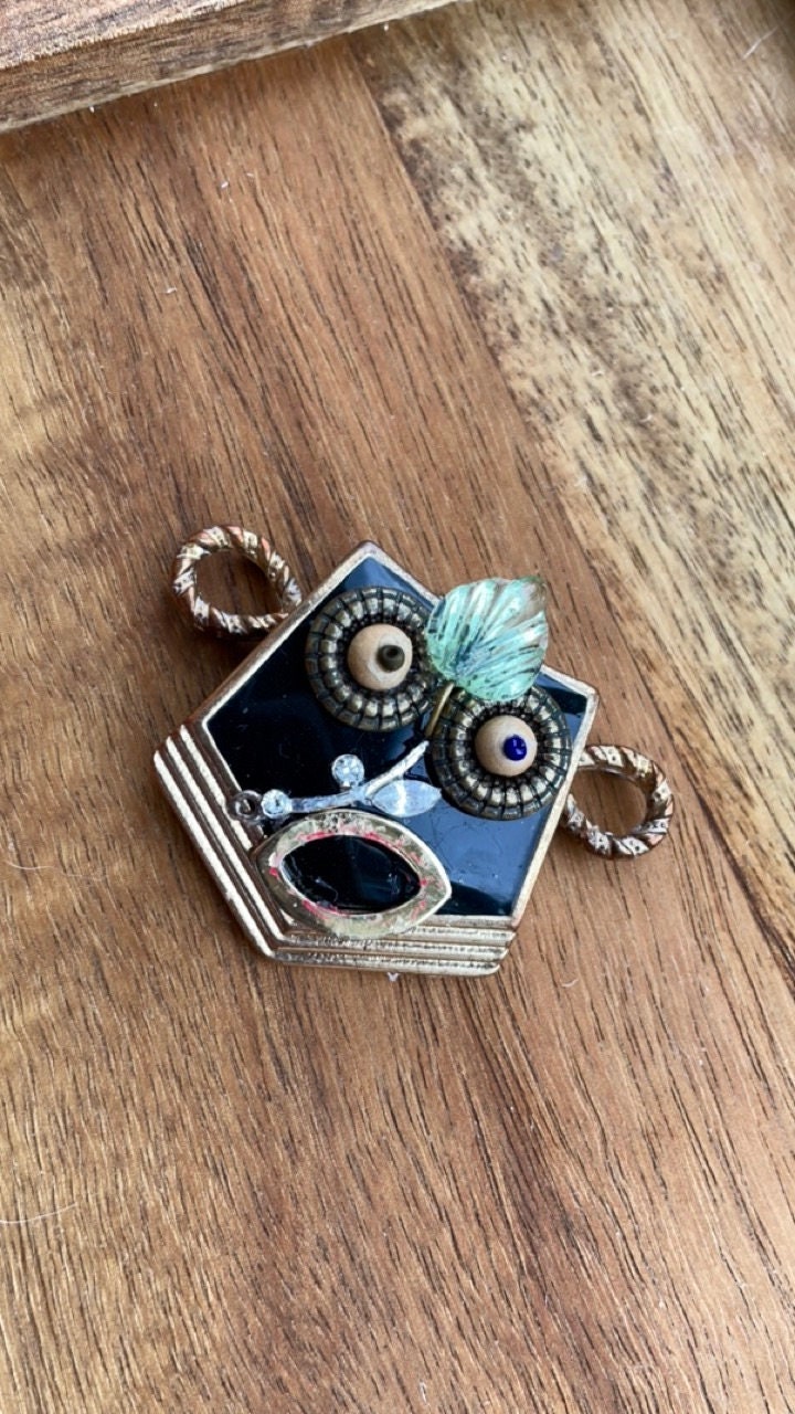 This monkey is a really cool assemblage art piece - it can be transformed into a necklace pendant, pin, magnet, small ornament or ring