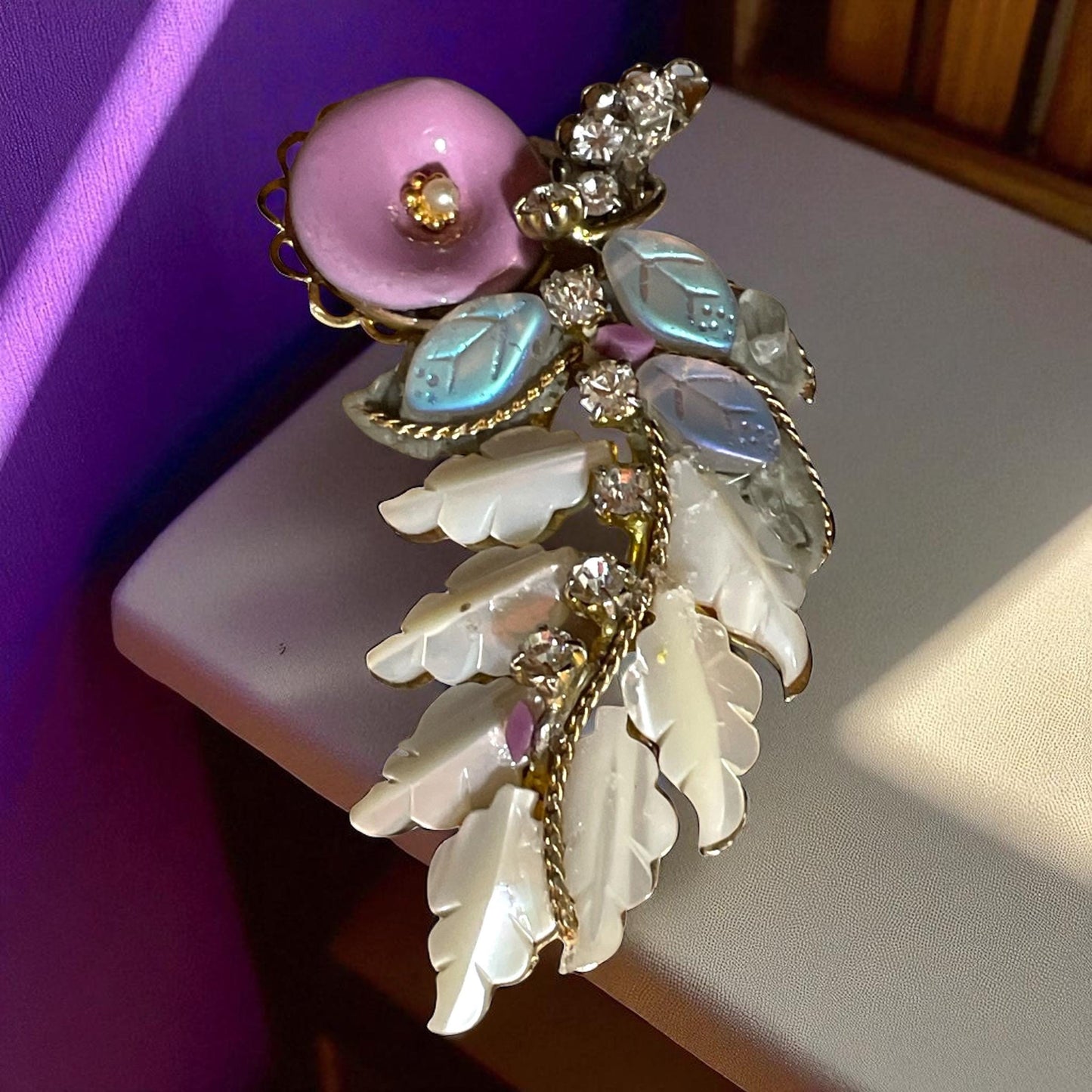 Unique mixed material brooch pin - pink enameled flower with faux pearl center, mother of pearl & white iridescent glass leaves, rhinestones
