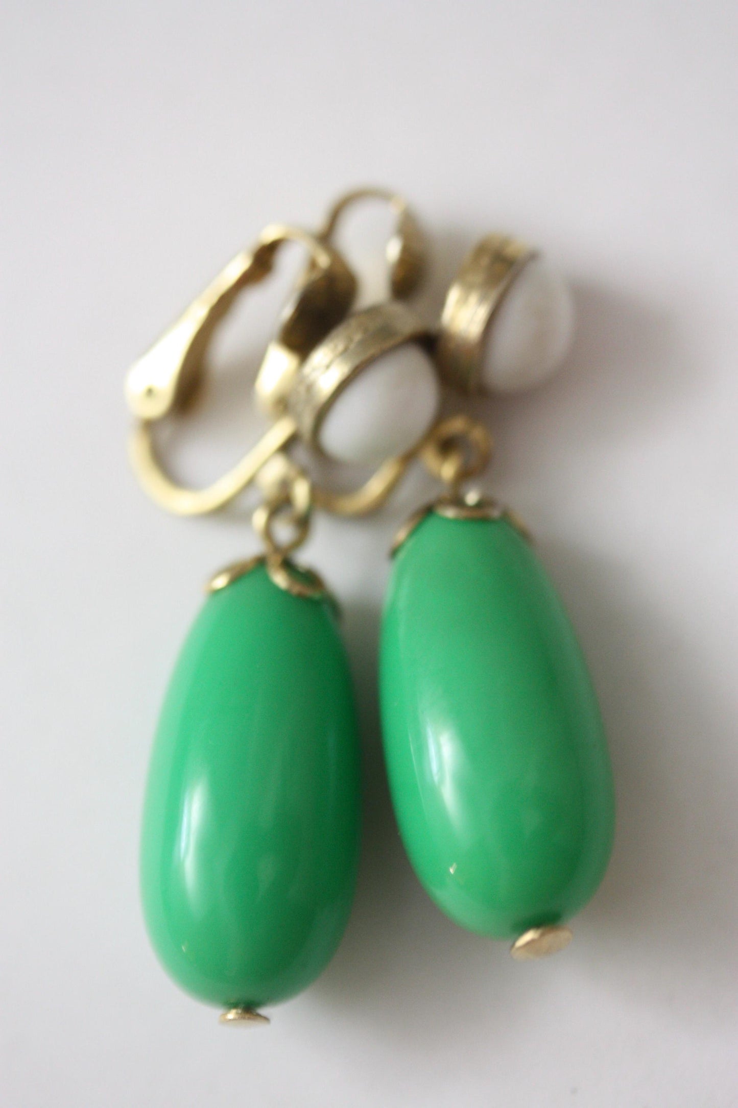 Green and white vintage Avon clip on dangle earrings