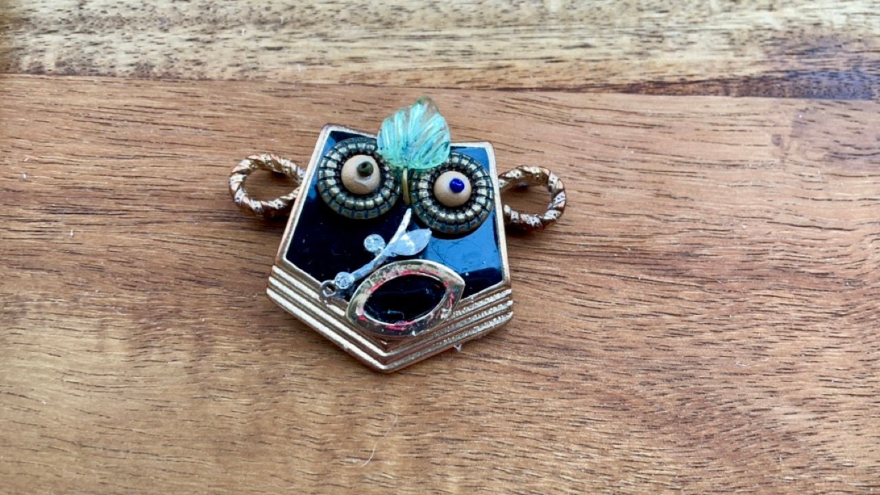 This monkey is a really cool assemblage art piece - it can be transformed into a necklace pendant, pin, magnet, small ornament or ring