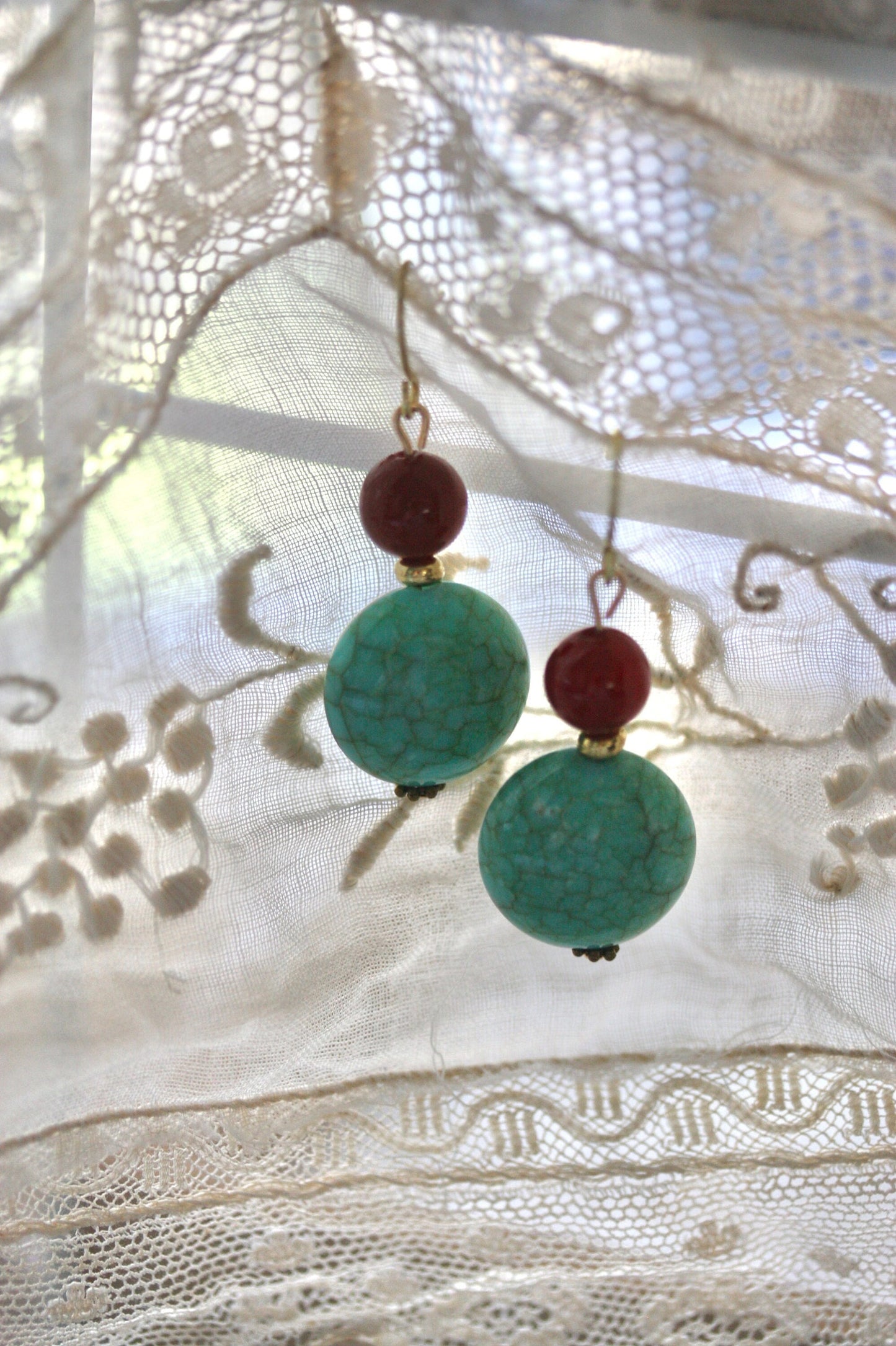 Dangle earrings made of faux turquoise and deep red glass