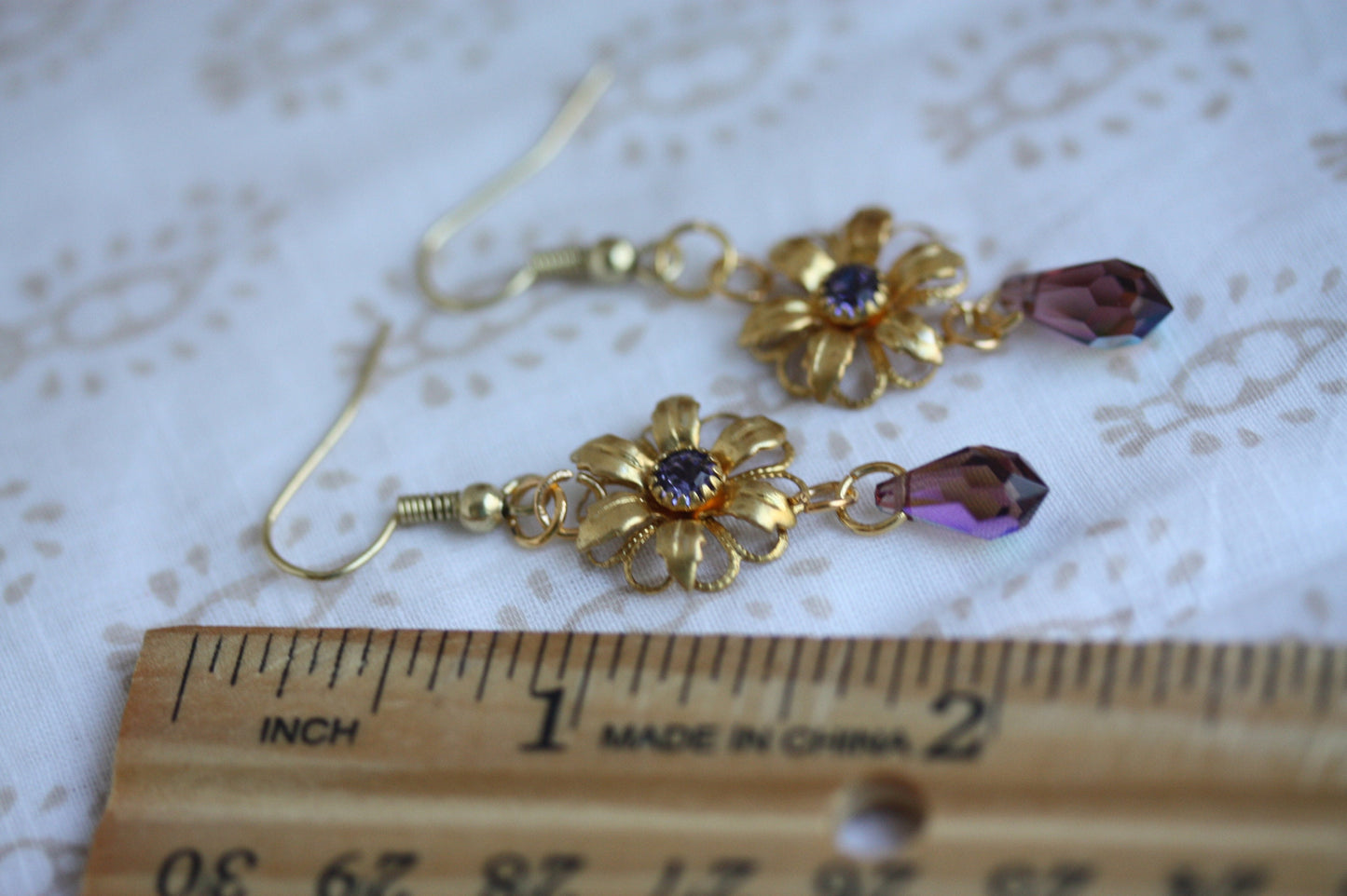 Handmade earrings - made up of vintage & new components - gold flowers with purple rhinestones and crystal dangles