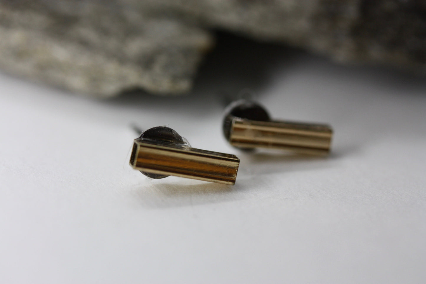 Tiny barely-there goldtone bar on silvertone circle minimalist stud earrings