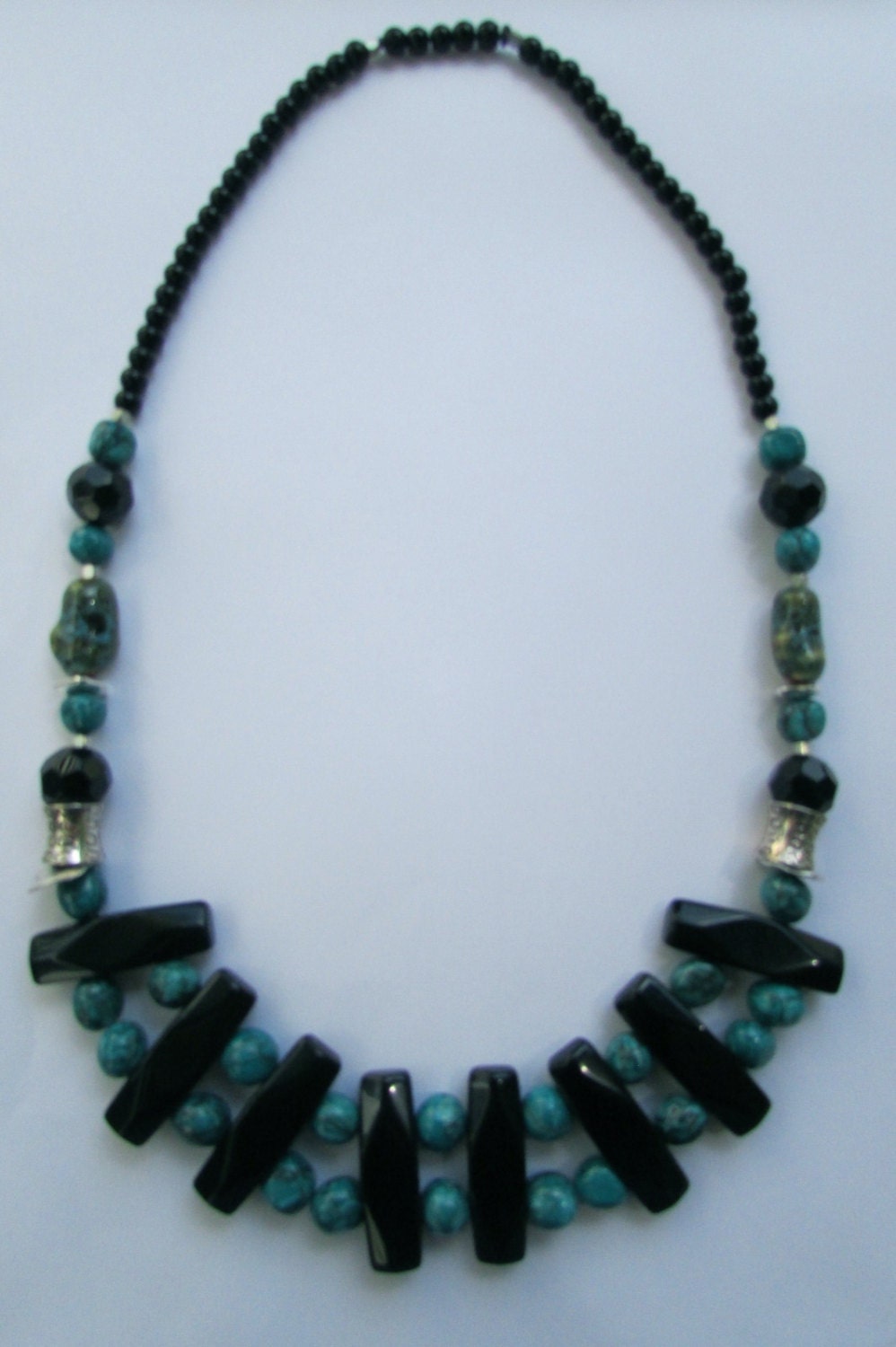 Mixed material beaded necklace - porcelain, metal, plastic, glass - shades of turquoise & black
