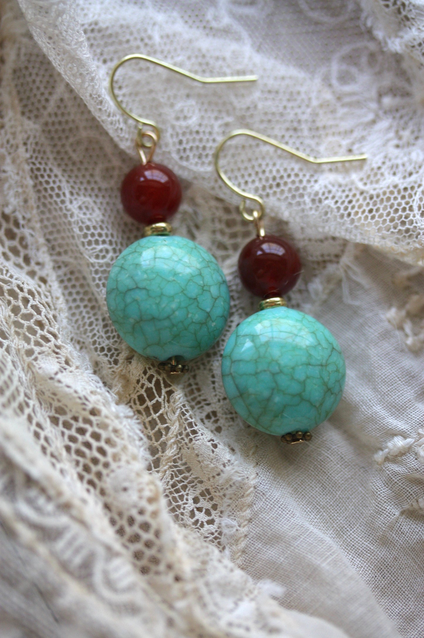 Dangle earrings made of faux turquoise and deep red glass