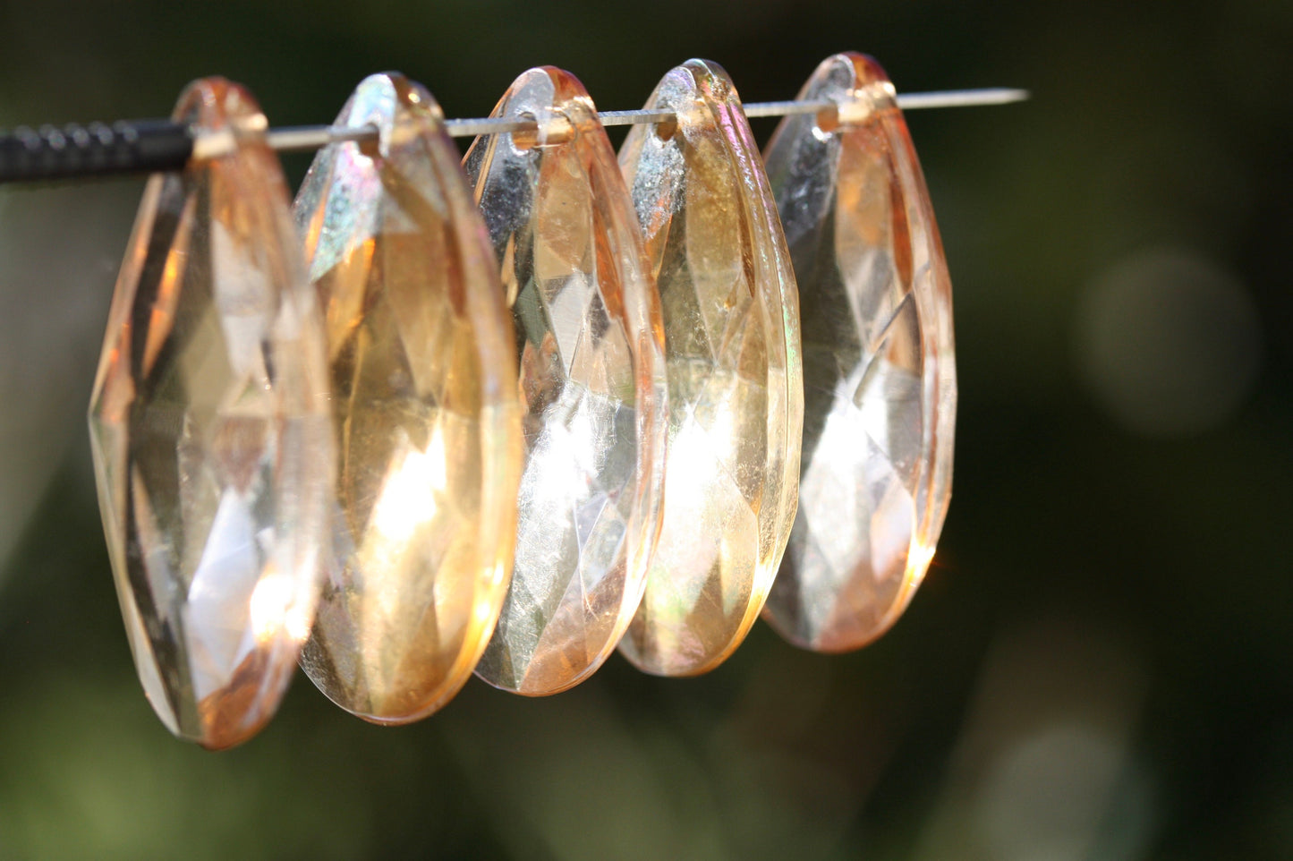 Large light gold glass golden teardrop crystals from a vintage chandelier