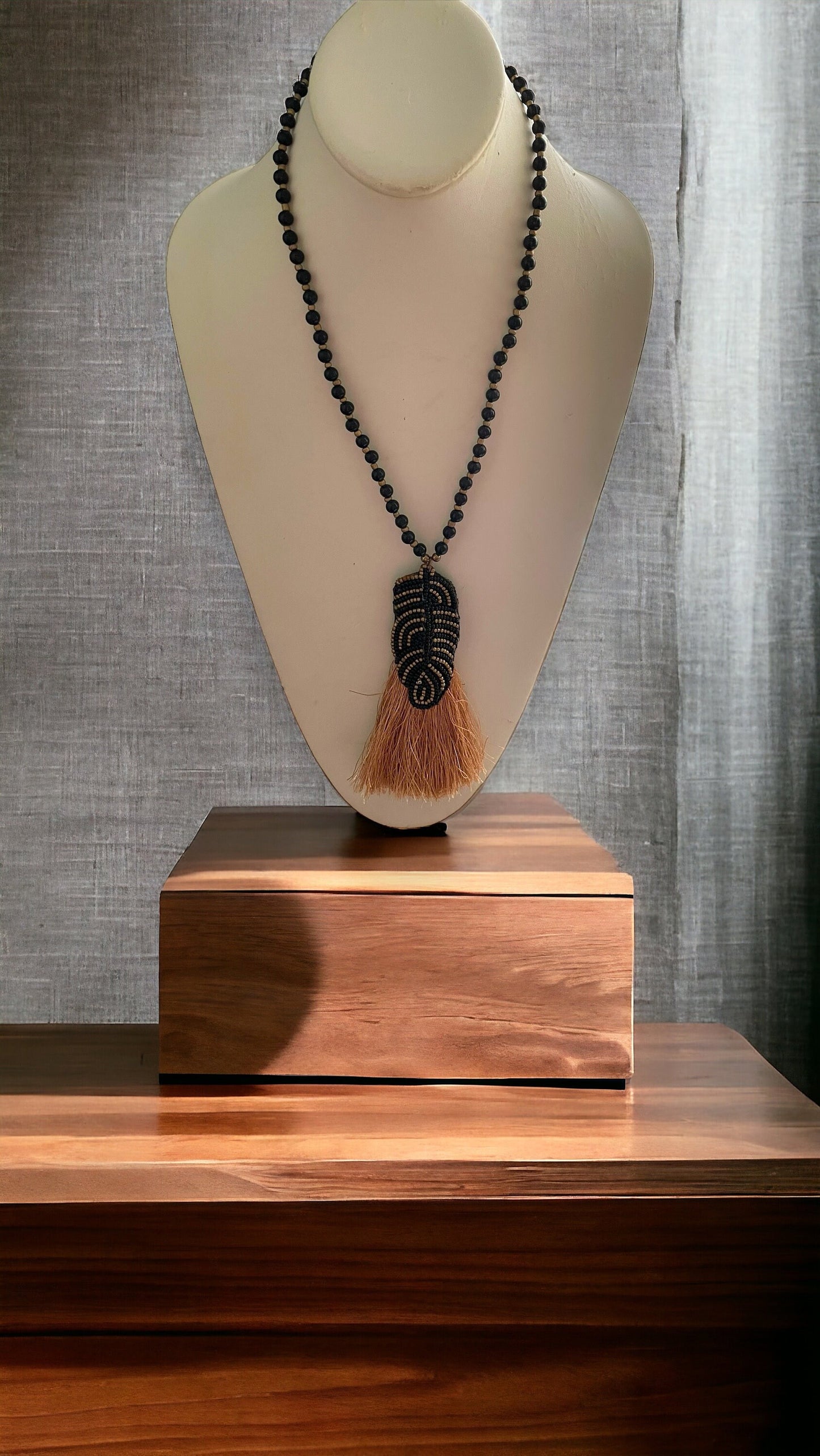 Stunning and unique hand beaded vintage artisan black and gold tassel necklace
