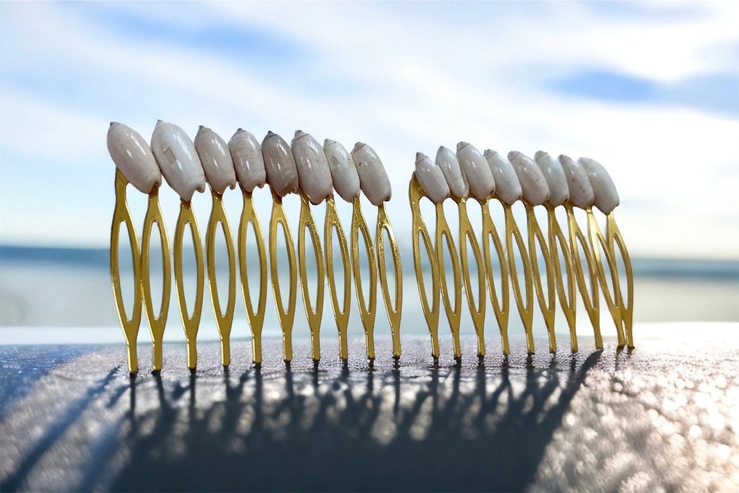 Stunning goldtone hair comb with white shells