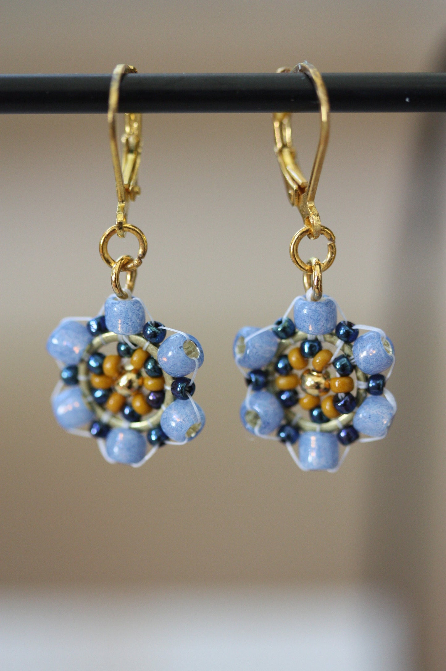 Tiny little dangles hand beaded seed bead  earrings - shades of blue and gold with goldtone center