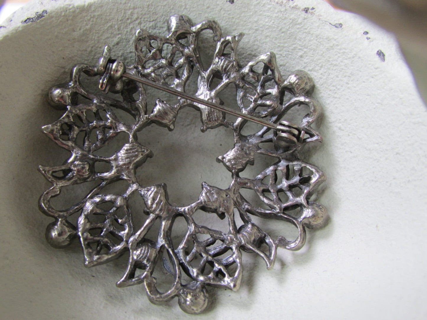 Vintage silver leaf and rhinestone wreath pin