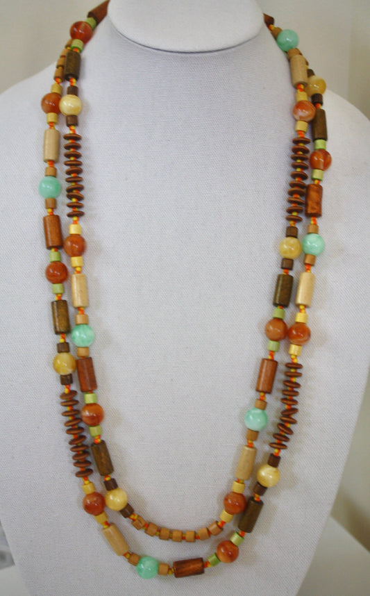 Stunning mixed materials extra long vintage necklace - variety of shapes and sizes of wood, striped glass, resin, seed beads and more