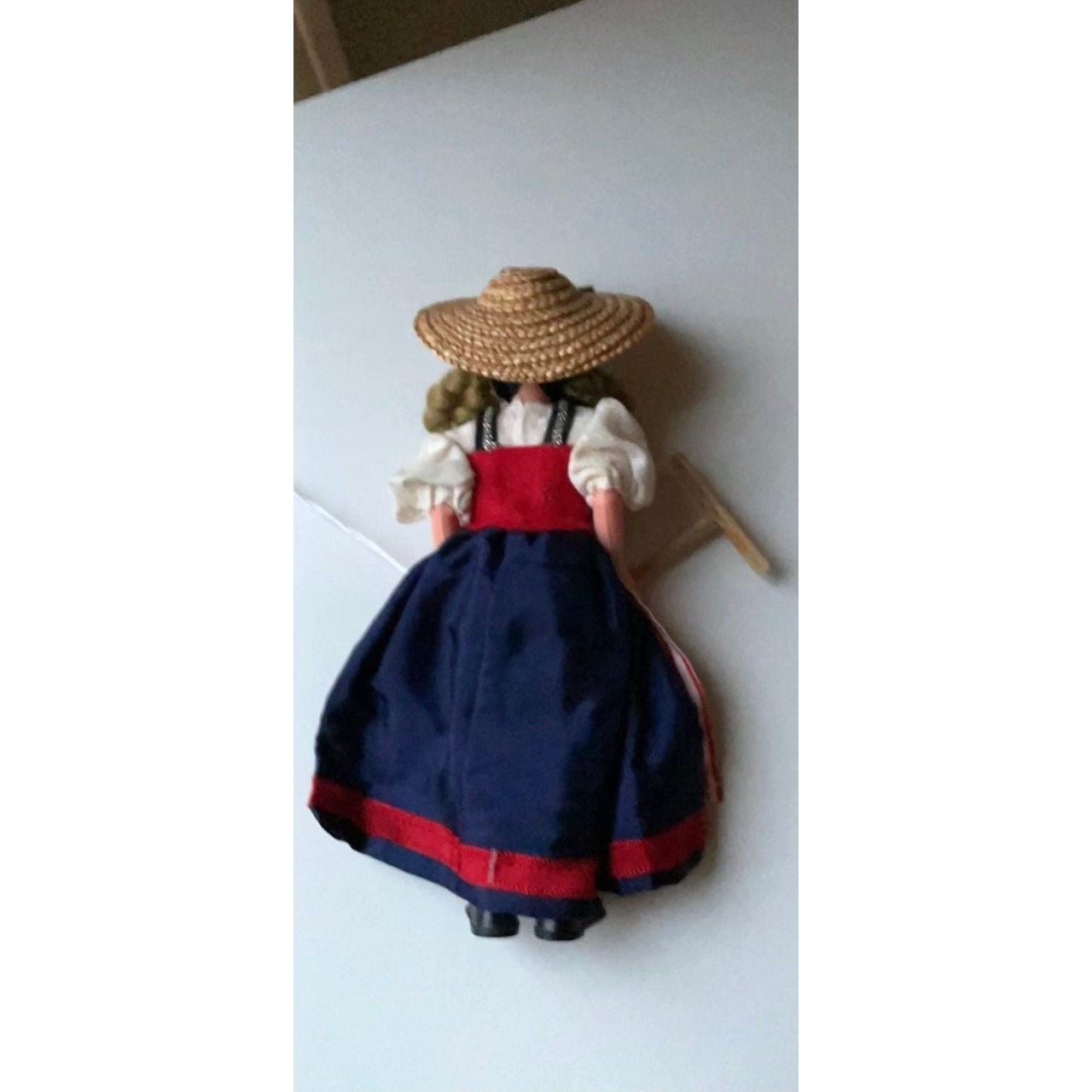 Vintage collectible handmade doll from Luganos Switzerland - with traditional handmade clothing and wooden rake