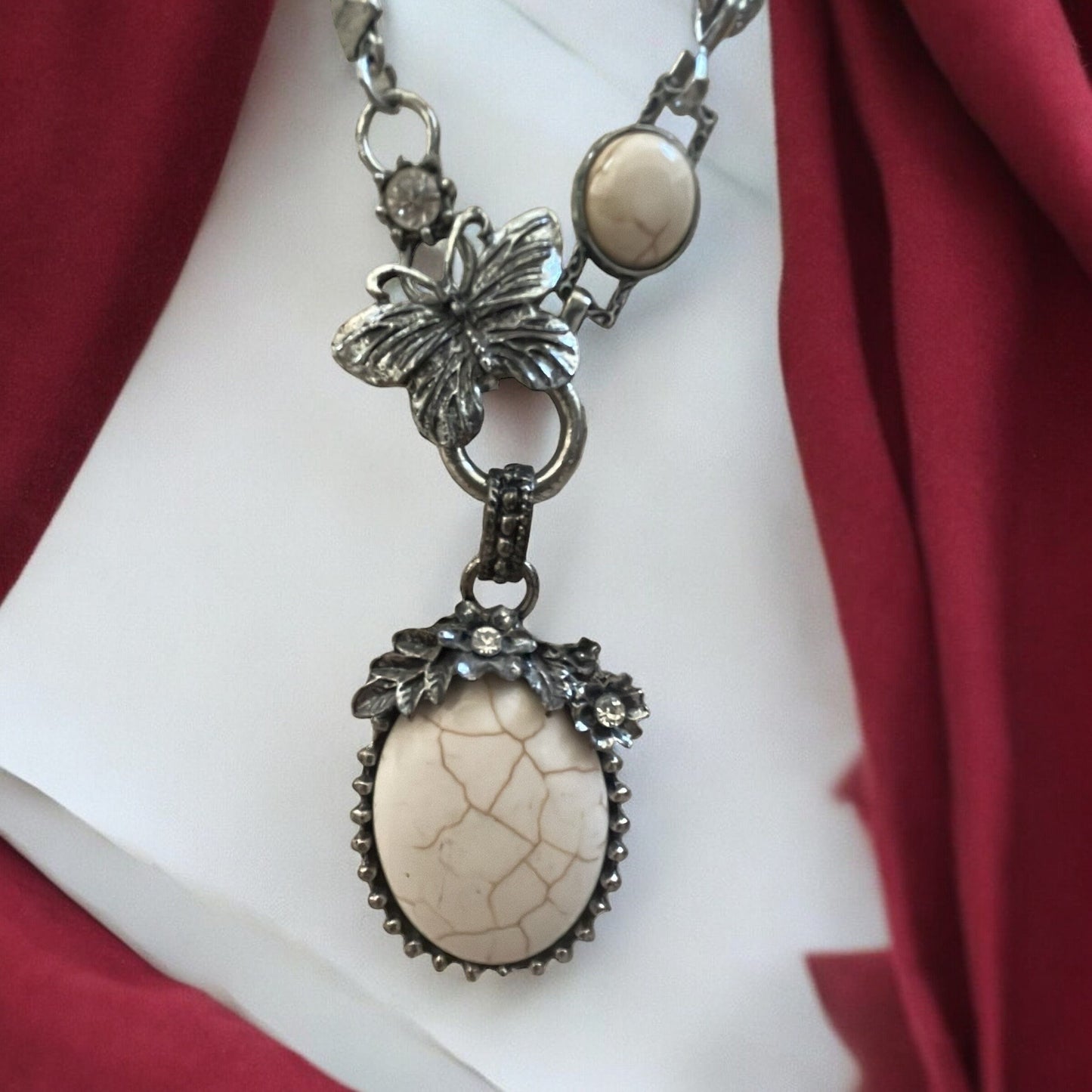 Stunning vintage white faux stone necklace with silver flowers and butterfly