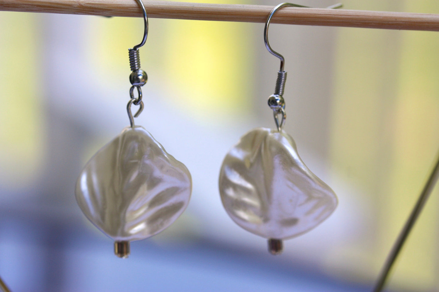 Pearlescent leaves dangle earrings trimmed with tiny sparkly seed beads