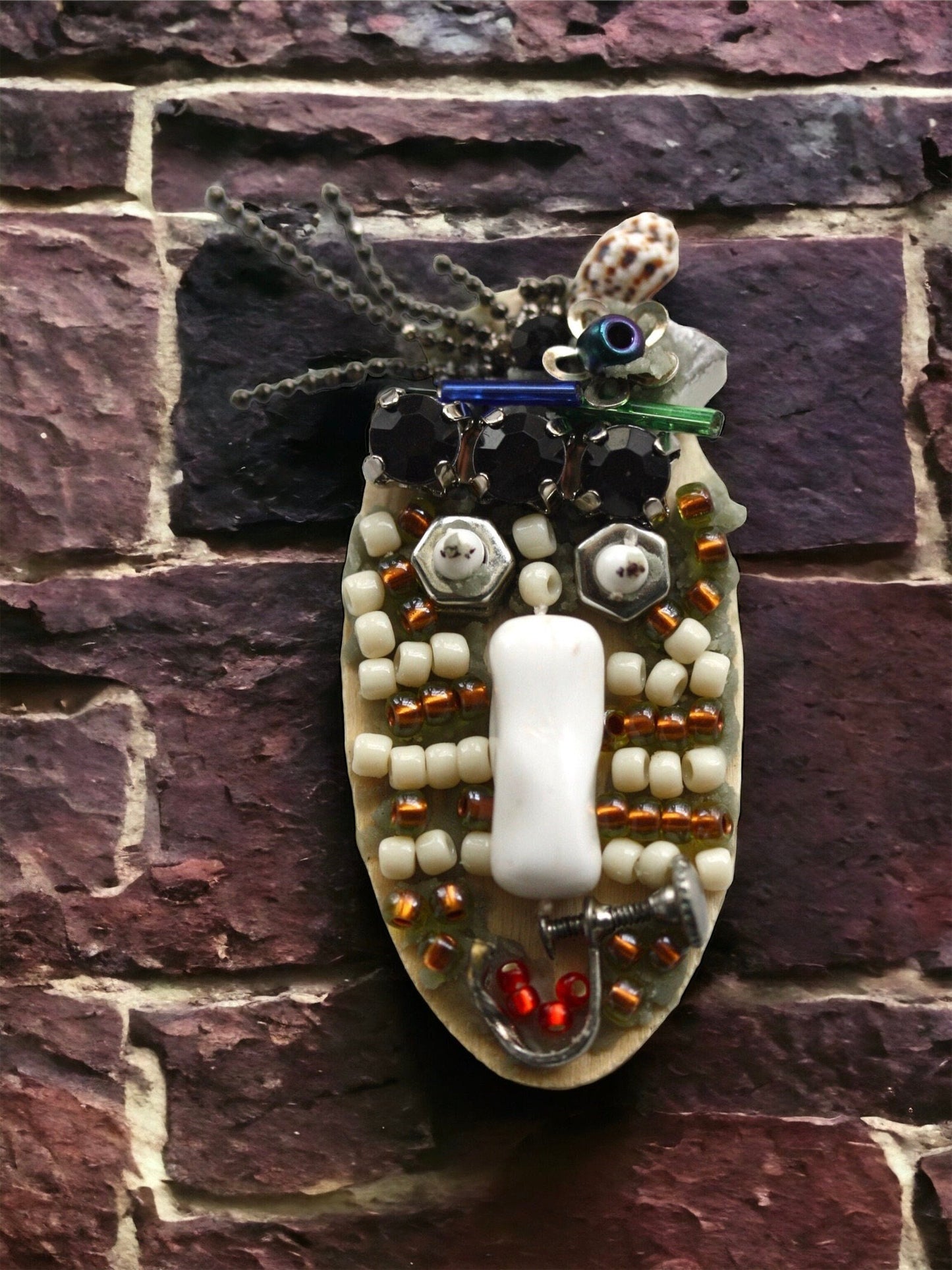 Meet "Sabina."  Sabina is a really cool assemblage art gal who can be transformed into a necklace, pin or magnet