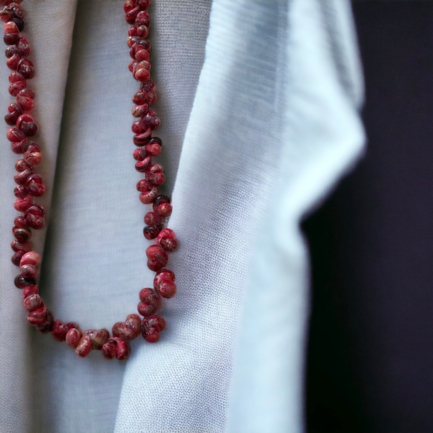 Unique vintage artisan shell necklace - shades of reddish pinks