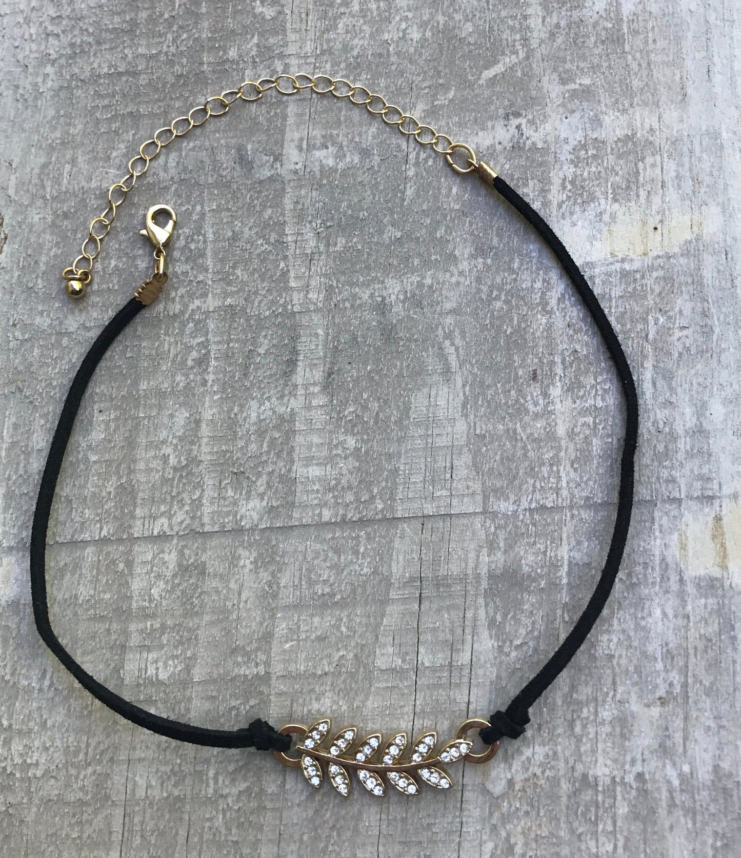 Vintage Rhinestone feather on black vintage necklace