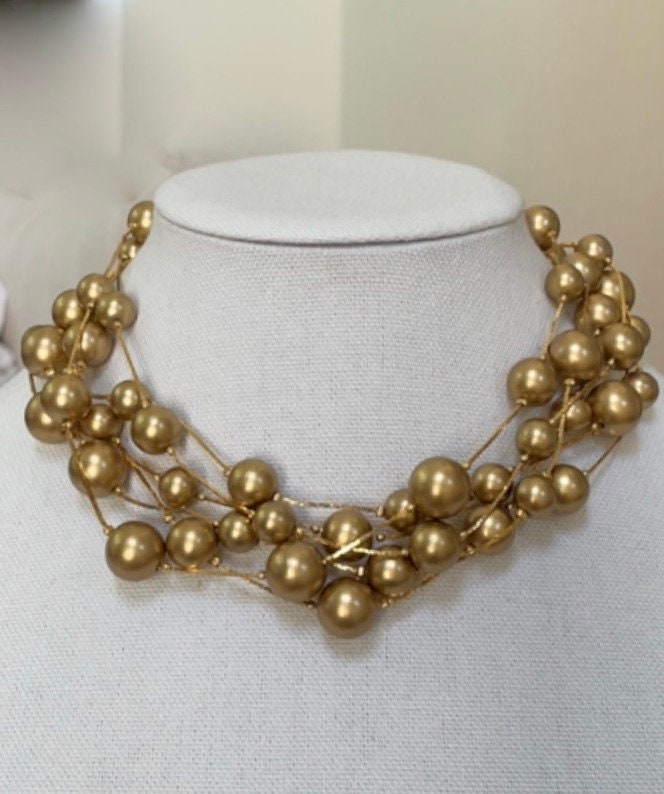 Stunning vintage multi strand goldtone faux pearl necklace