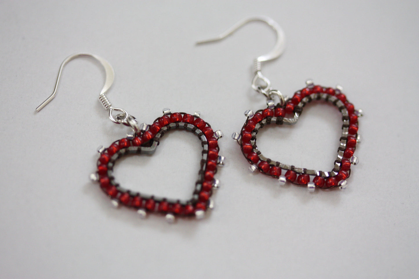 Small intricately beaded heart dangle earrings - original beadwork