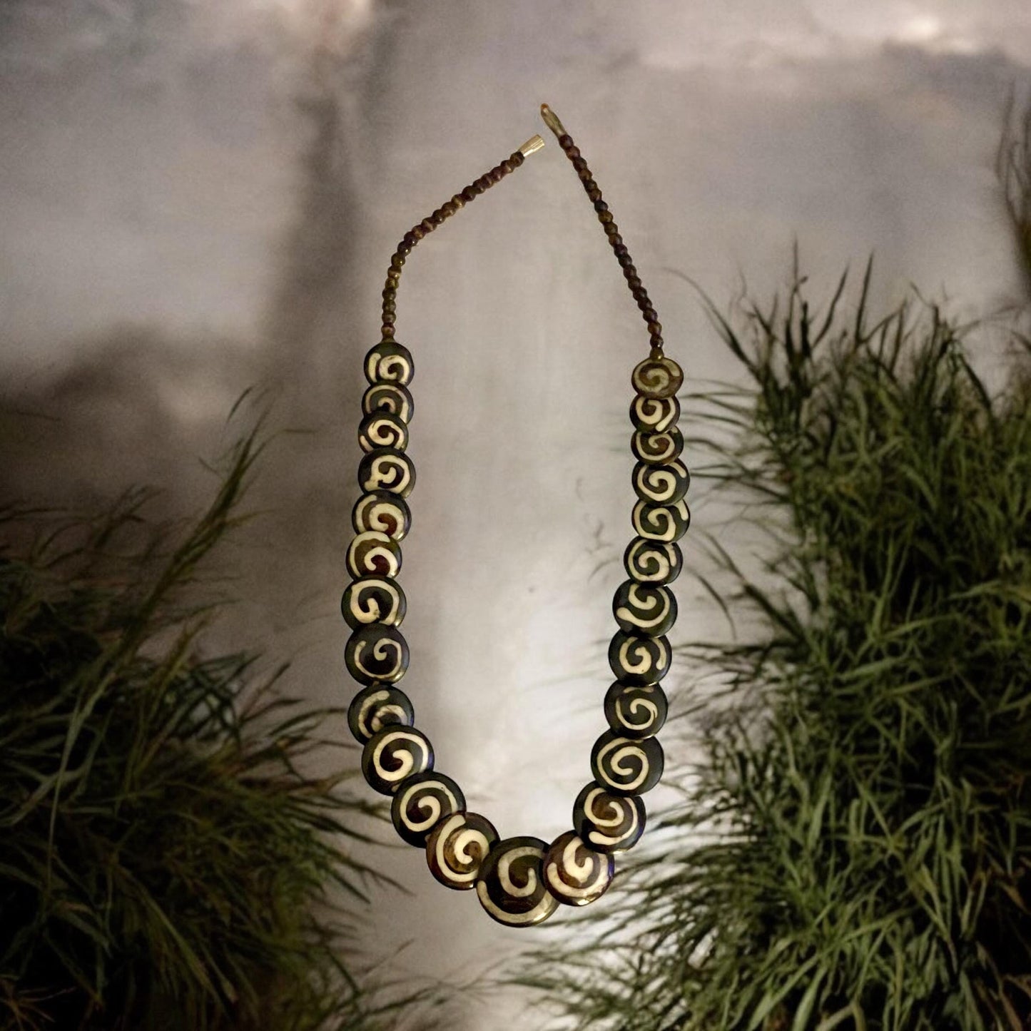 Tribal style vintage necklace - with beautiful swirled discs that are either bovine or wood?