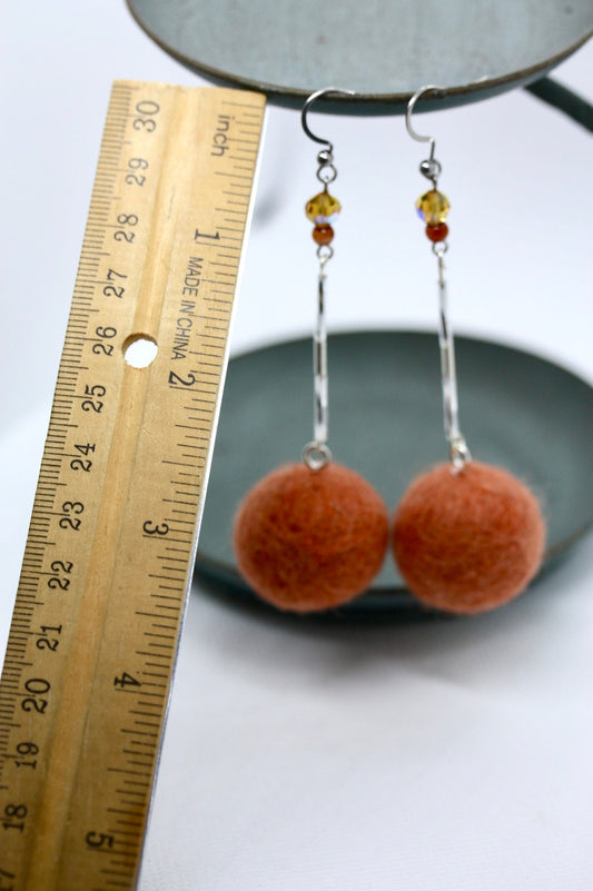 Long, 3.5 inch dangle earrings featuring purchased handmade sheep farm felt coupled with my beedwork