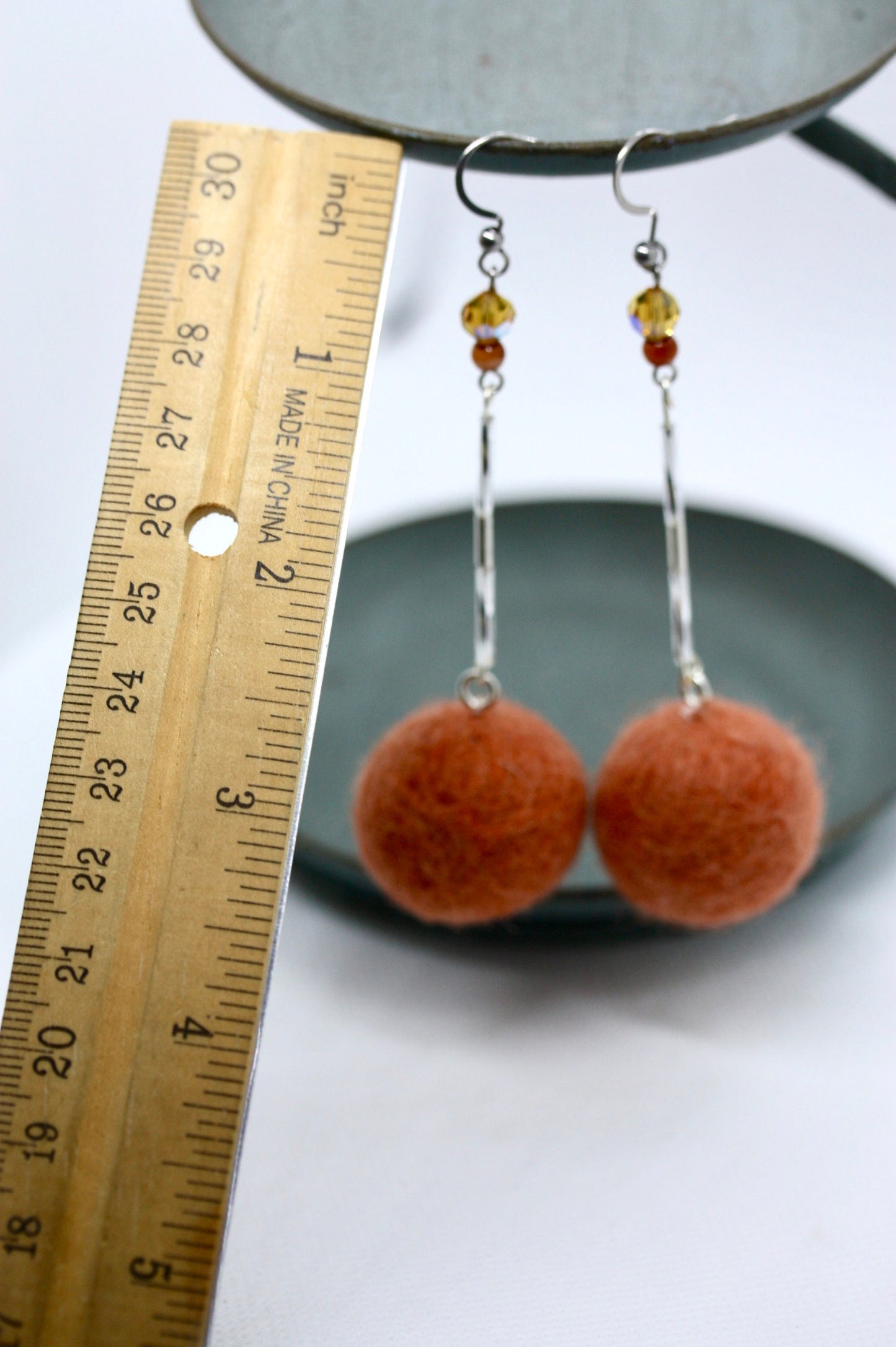 Long, 3.5 inch dangle earrings featuring purchased handmade sheep farm felt coupled with my beedwork