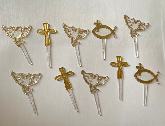 Mix of clear and gold plastic cake toppers - cross, fish and dove