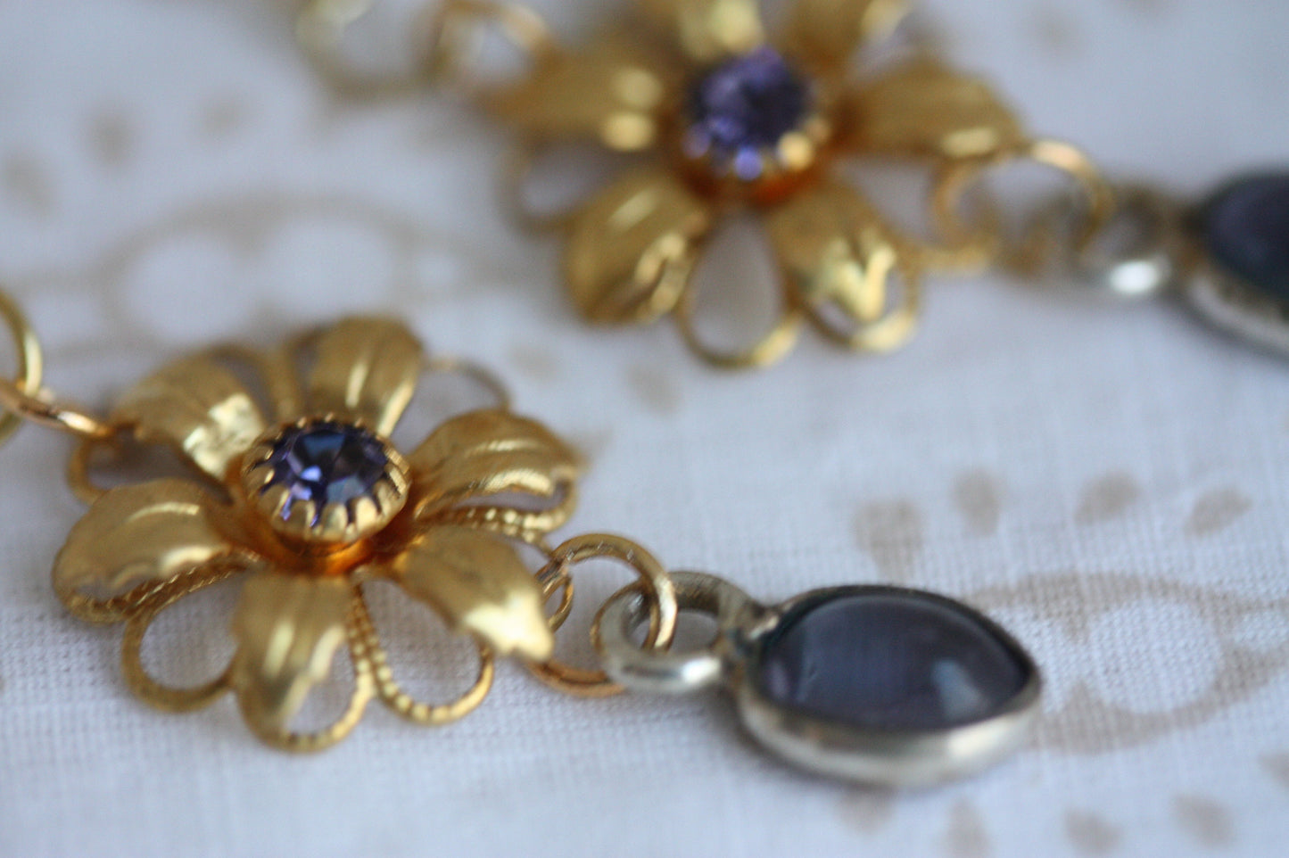 Handmade earrings - made up of vintage & new components - gold flowers with purple rhinestones and purple dangles