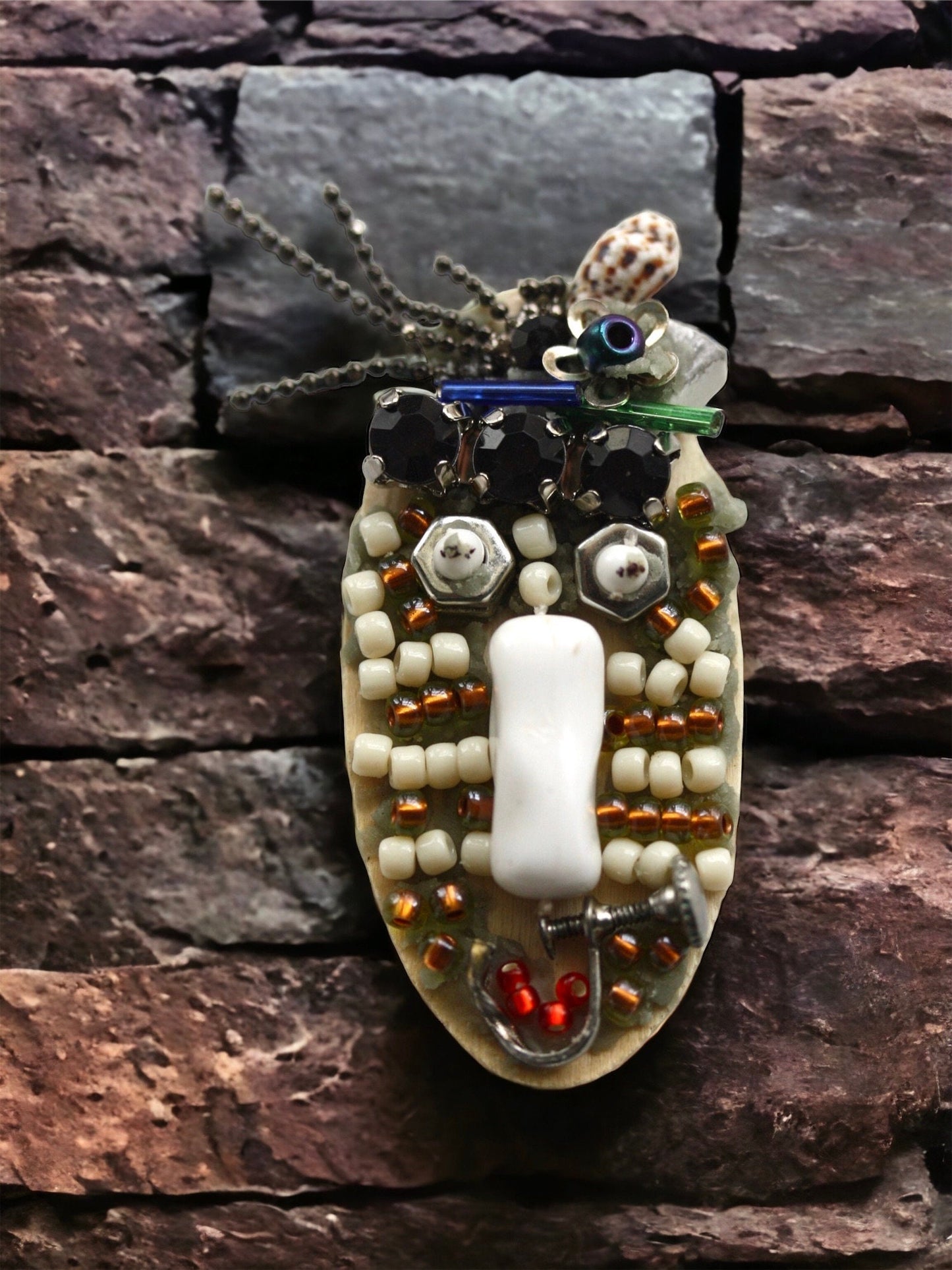 Meet "Sabina."  Sabina is a really cool assemblage art gal who can be transformed into a necklace, pin or magnet